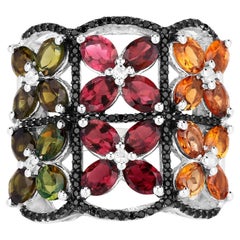 Bague en tourmaline multicolore avec topazes blanches et spinelles noires 8,38 carats