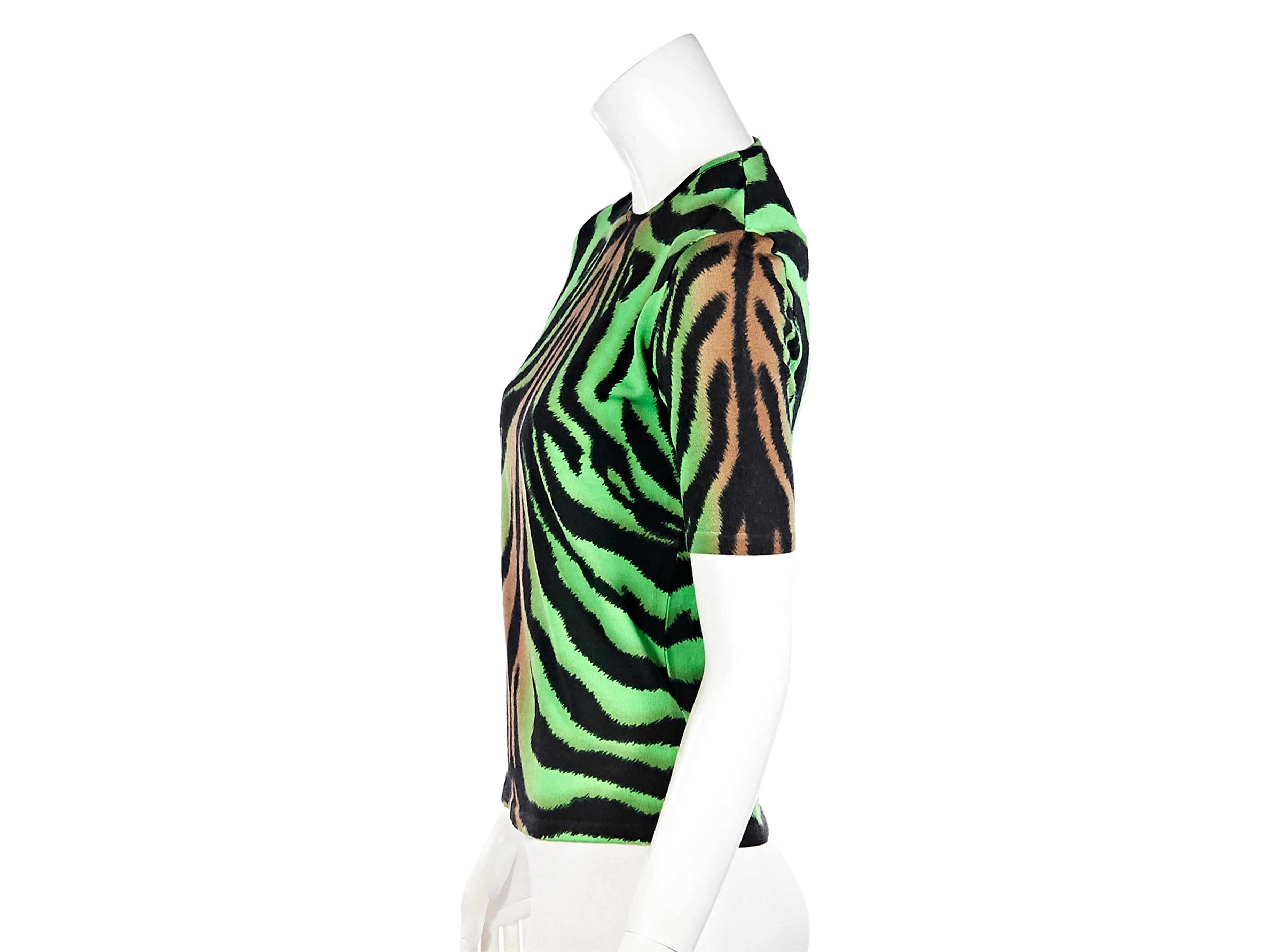Product details:  Multicolor tiger-printed knit top by Versace. Crewneck.  Short sleeves. Ribbed hem. Pullover style. Wear yours with high-waist jeans.  Label size IT 42. 30
