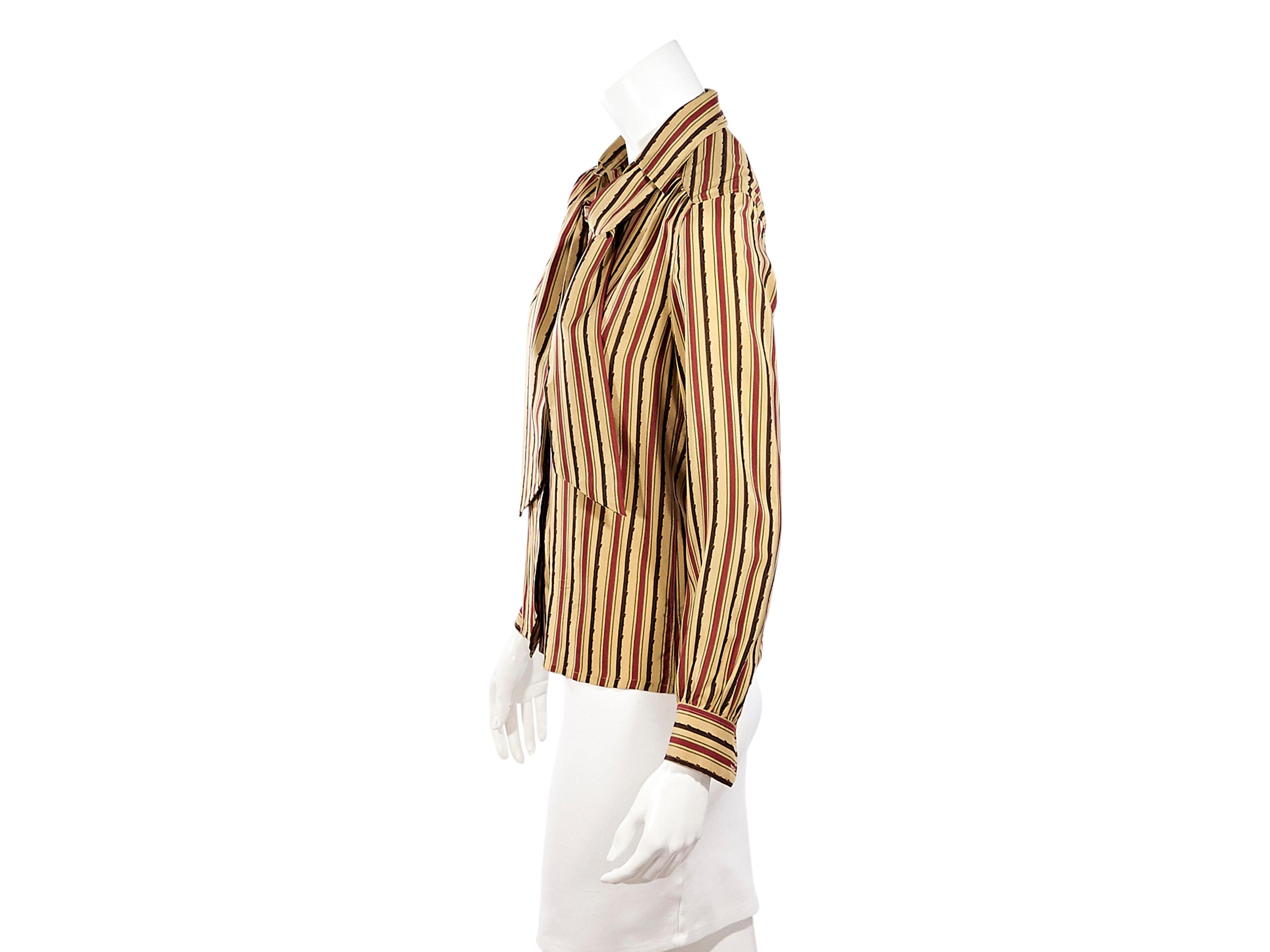 Product details:  Vintage multicolor striped silk blouse by Celine.  Spread collar with pussy bow.  Long sleeves.  Double button detail at cuffs.  Button-front closure.  Label size FR 36.  36