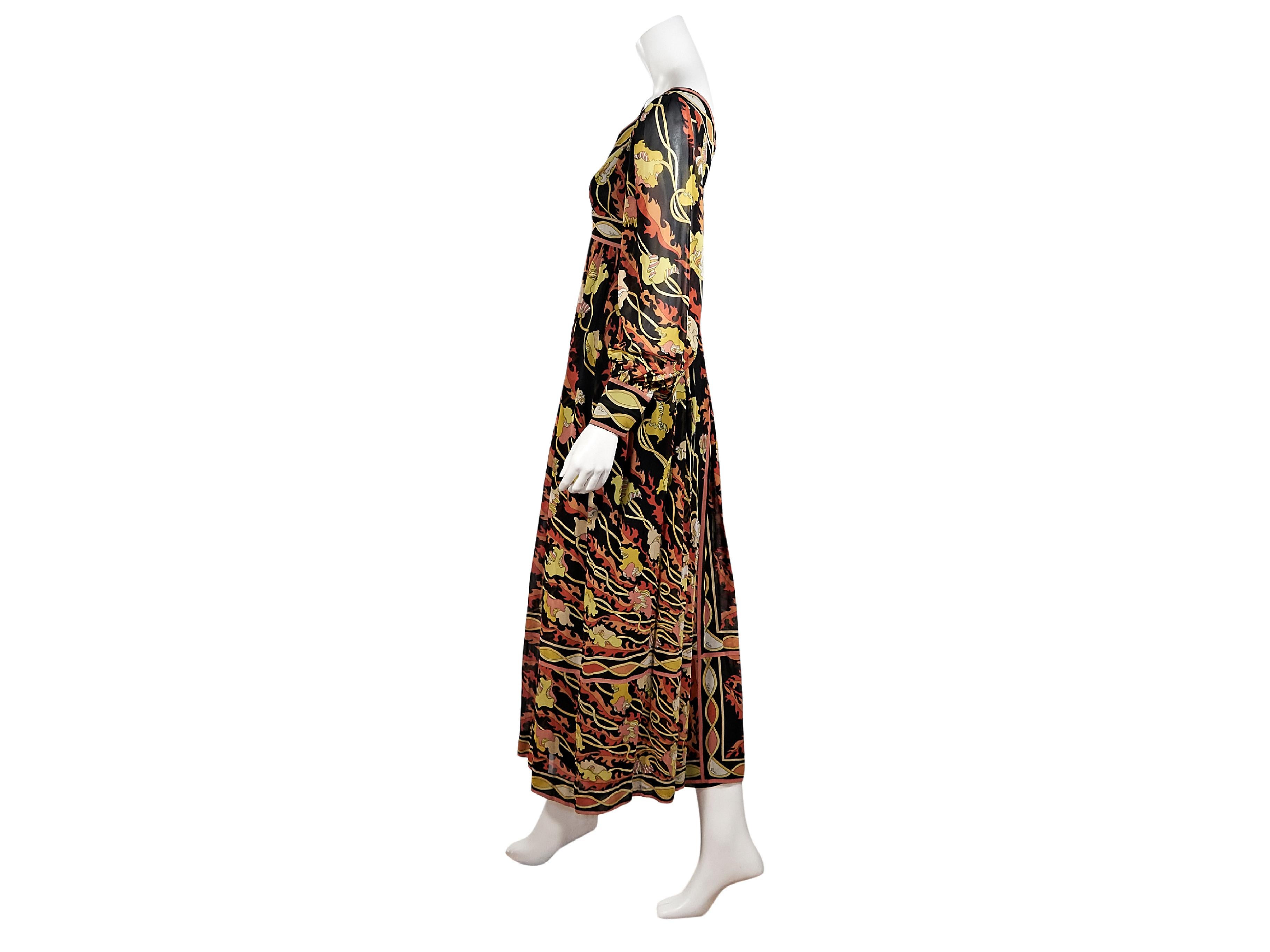 Product details:  Vintage multicolor printed jumpsuit by Emilio Pucci.  Scoopneck.  Long sleeves.  Concealed back zip closure.  Palazzo-style panting.  32