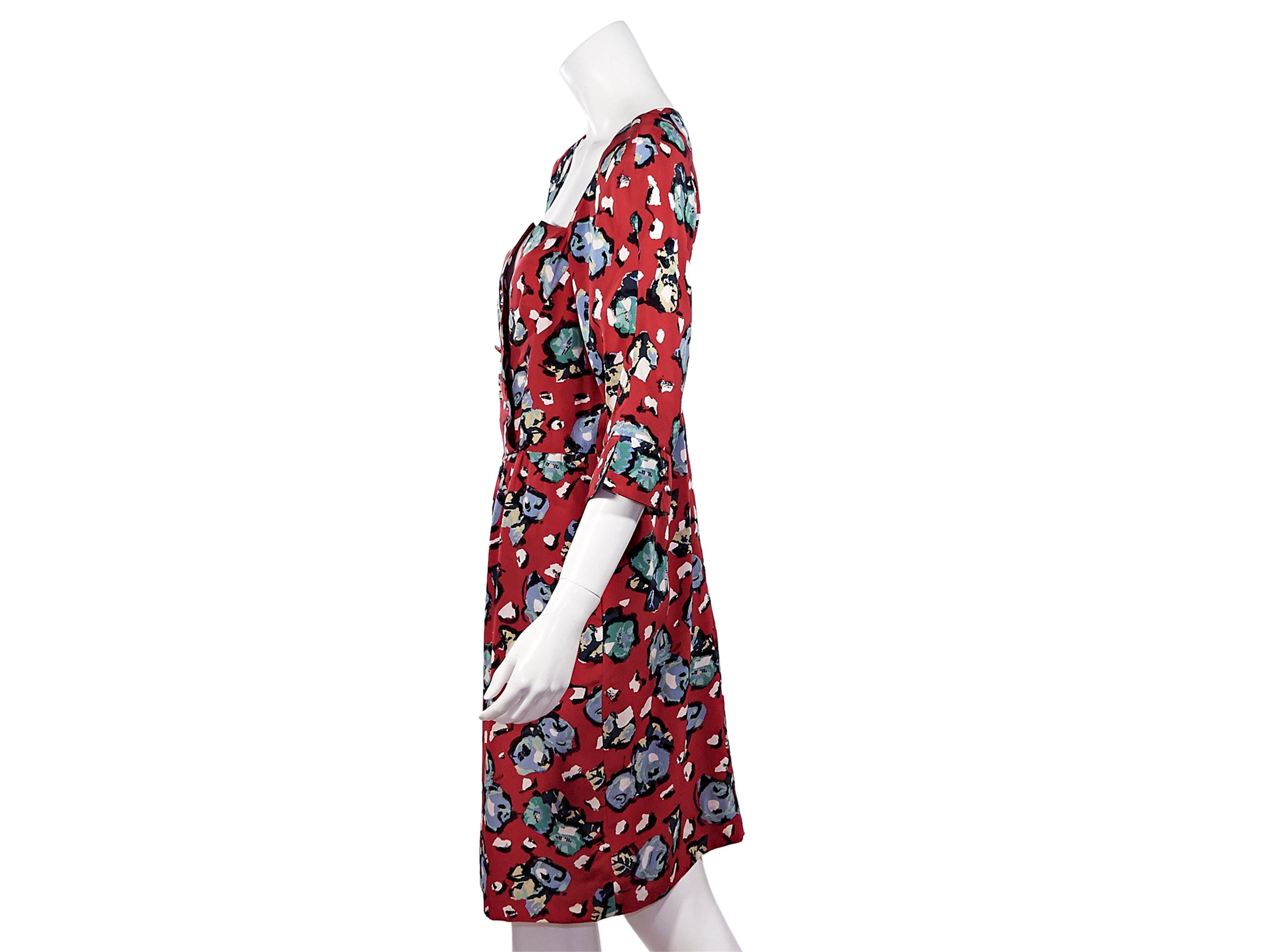 Product details:  Vintage multicolor floral-printed silk dress by Karl Lagerfeld.  Elbow-length sleeves.  Button-front bodice.  Concealed back zip closure.  36
