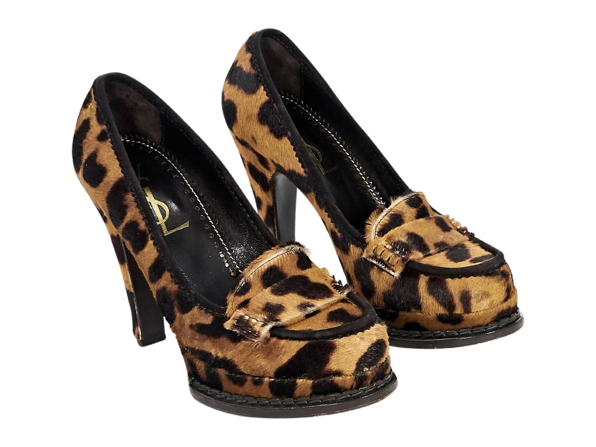 Product details:  Multicolor leopard-print pony hair platform loafers by Yves Saint Laurent.  Round moc toe.  Slip-on style. 
Condition: Pre-owned. Very good. 
Est. Retail $525