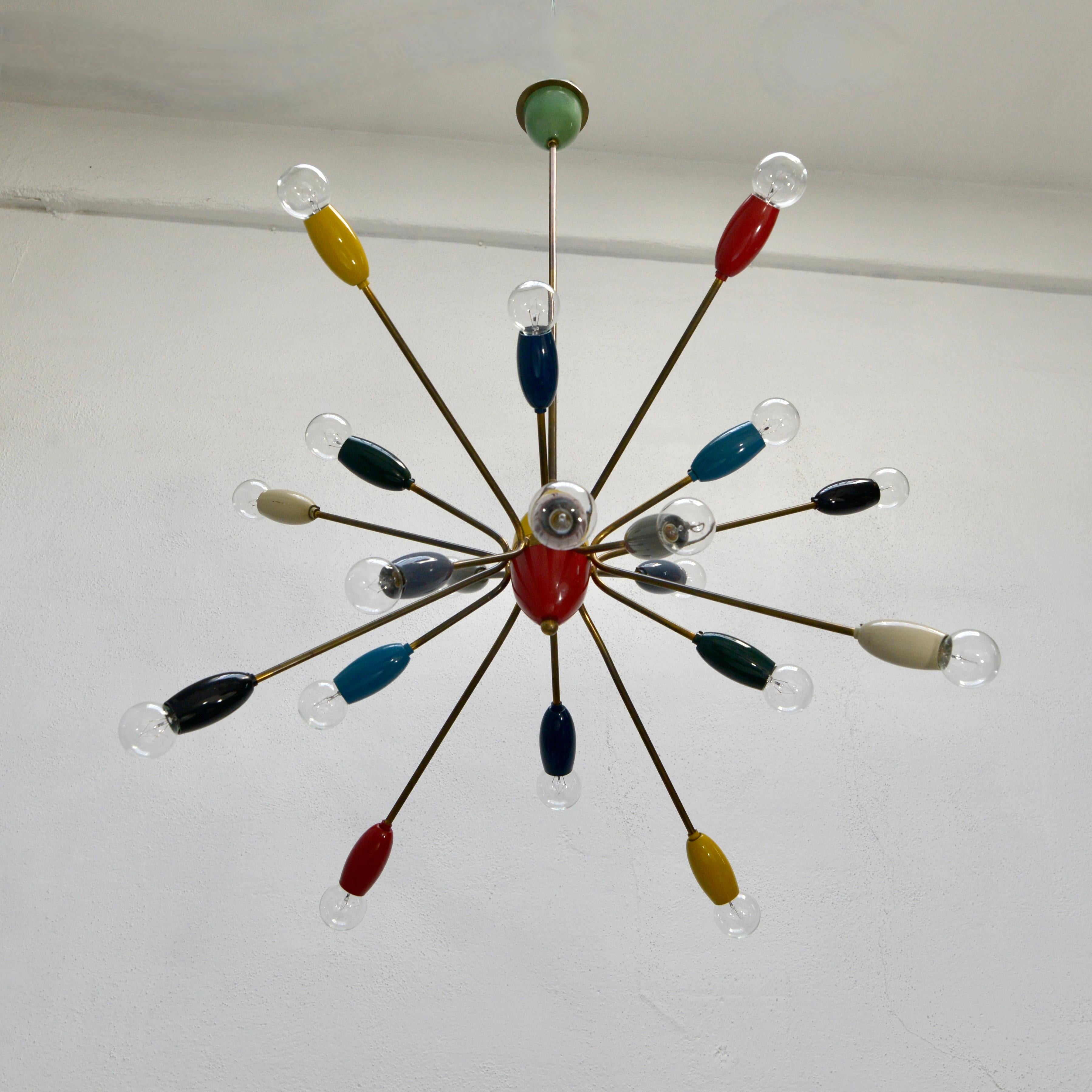 A stunning 1950s multicolored chandelier from Italy, with original brass and painted aluminum finish.  Partially restored and rewired with 20 E12 candelabra based sockets. for use in the US. Light bulbs included with order. 
Measurements:
OAD: 42”