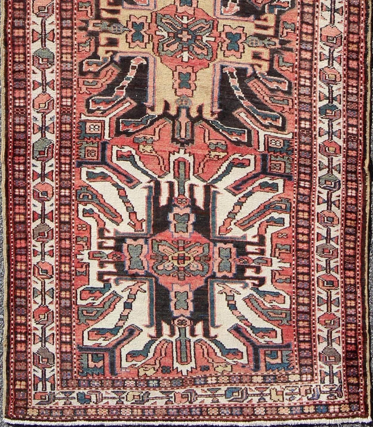 Multicolored Antique Persian Karajeh Runner With Vertical Geometric Tribal Medallions. Keivan Woven Arts / rug H-202-29, country of origin / type: Caucasus / Karadjeh, circa 1920
Inspired by 19th century Eagle Kazak, the field design of this early