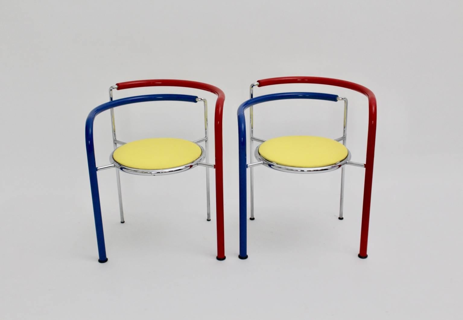 This pair of red, blue and yellow colored armchairs, which are also stackable, named Dark Horse, was designed by Rud Thygesen and Johnny Sorensen circa 1989 and executed by Botium, Denmark.

The legs are coated with red and blue colored PVC and the
