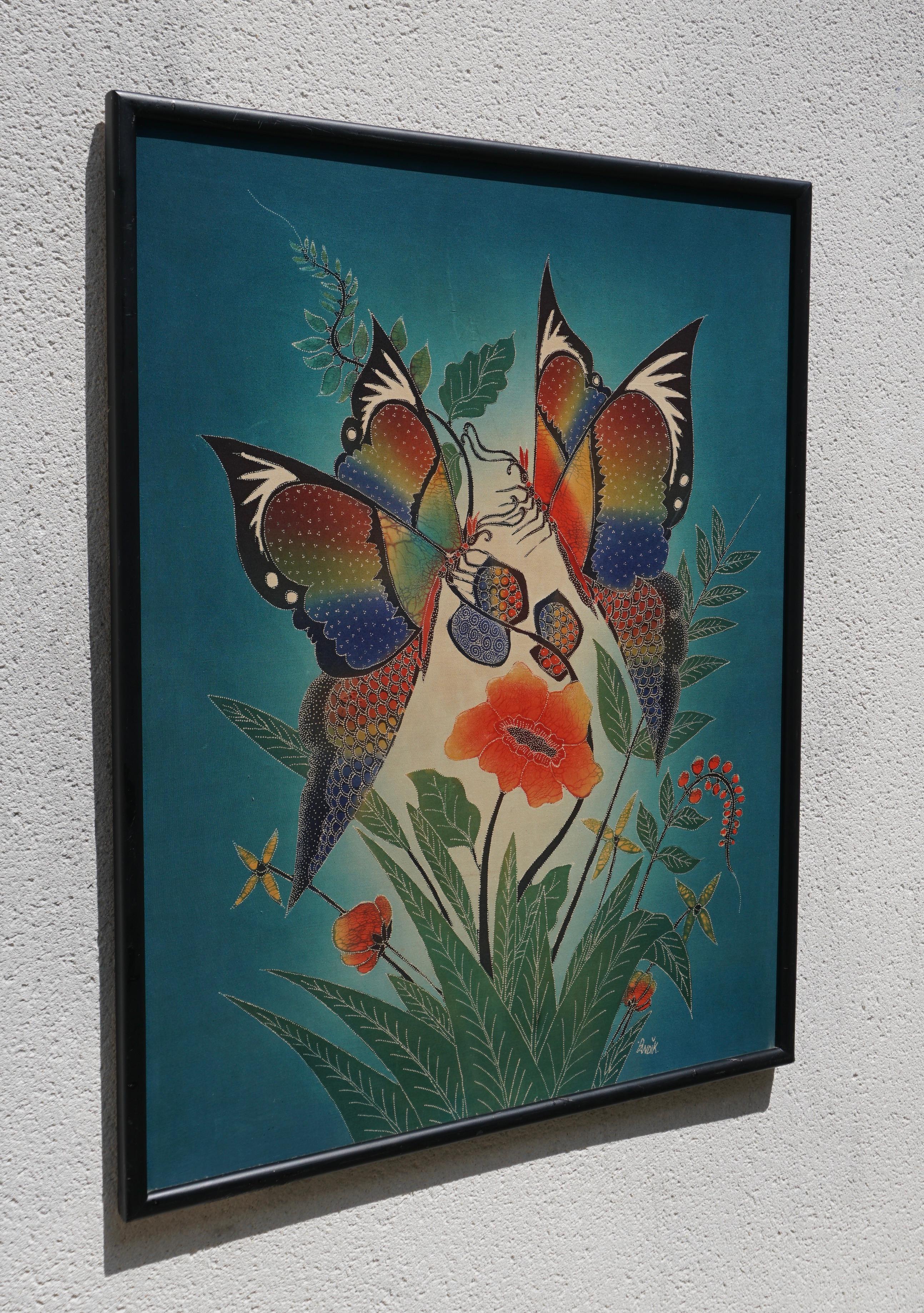Multicolored batik with butterflies and flowers on blue background, on frame. 
Central Java, circa 1970. Signed Pandik.

Exquisite Batik Wall Decoration with Butterflies and Flowers - Handmade in Indonesia

The artwork depicts a breathtaking scene