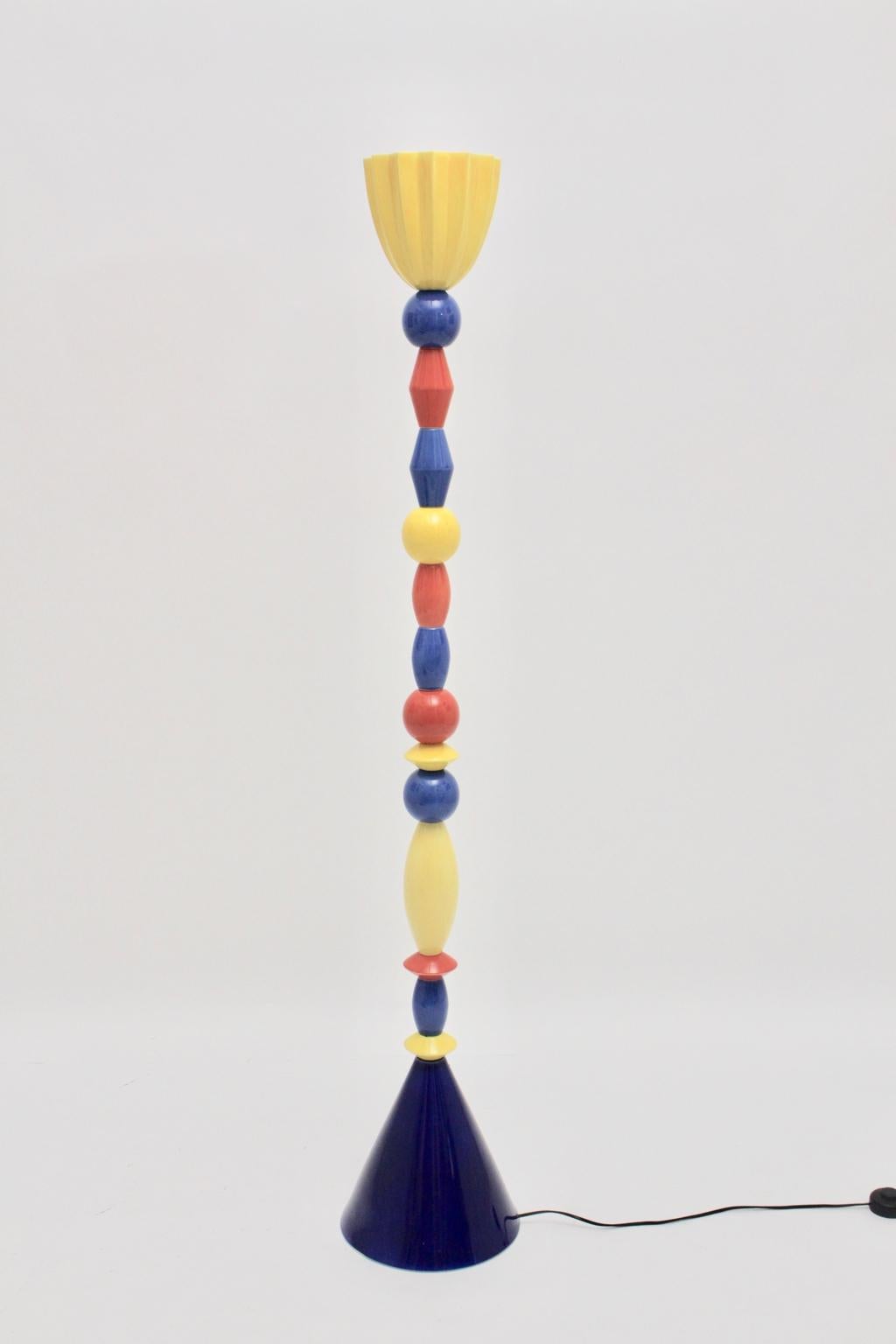 This extraordinary multicolored ceramic totem floor lamp shows various elements ( cobalt blue, sunshine yellow and tomato red ) in the style of Ettore Sottsass.
One socket E 27
On/off foot switch

Very good condition without spots, chips or