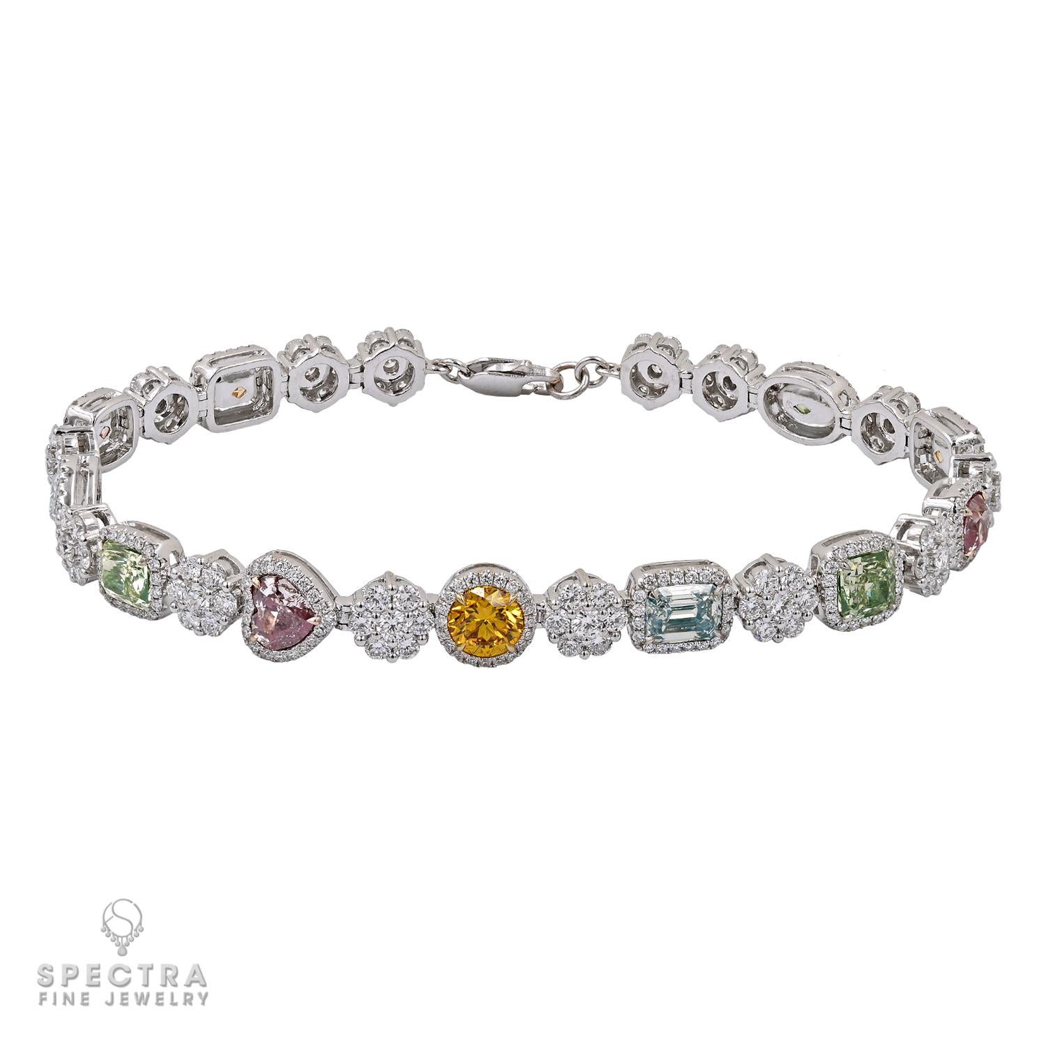 This lovely bracelet is adorned with a stunning array of gemstones, featuring 11 intricately arranged colored mix-shape diamonds, collectively weighing 5.85 carats. Each diamond is carefully selected, showcasing a brilliant fusion of shapes that add