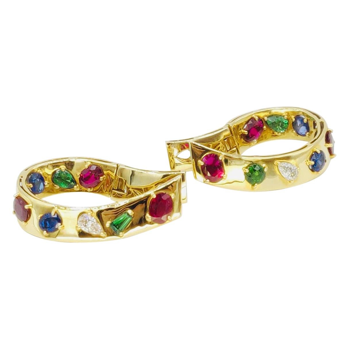These vibrant shiny 18K yellow gold hoop earrings are embellished with vivid multicoloured gemstones in various cuts, both inside and outside. Magnificent colourful pieces for numerous occasions.

Gold: 18K Yellow Gold, 24.808 g
Diamond: