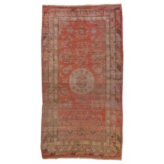 Antique Multicolored Distressed Khotan Rug