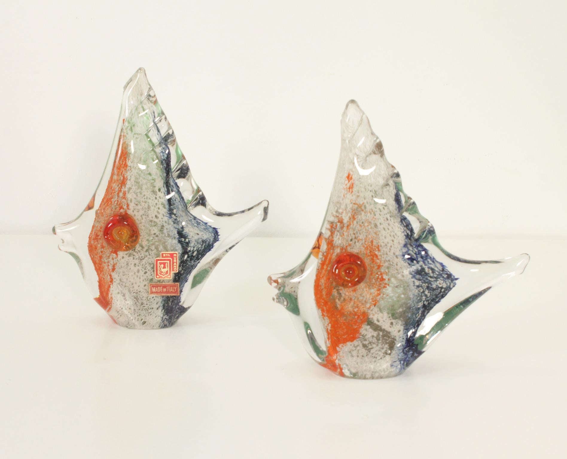 Multicolored Murano fish sculpture by Stil Murano, Italy, 1950's. Murano clear glass with layers of different color and textures, both figures retain the original label. Two pieces available. 