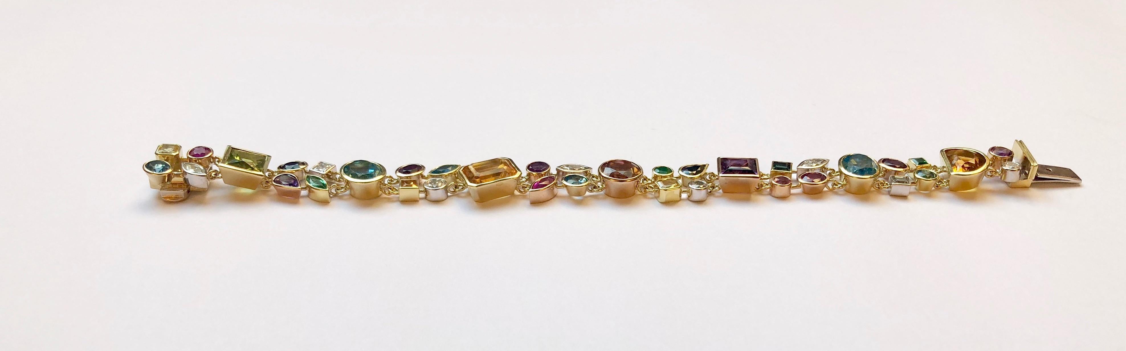 This stunning bracelet features several gemstones, such as topaz, emerald, diamond and amethyst. Each stone is set in white, yellow or rose 18kt gold, depending on the color as to best accentuate it.

This pendant was designed and made by Van der
