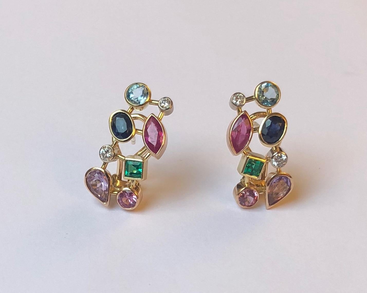 This stunning pair of earrings features several gemstones, such as topaz, emerald, diamond and amethyst. Each stone is set in white, yellow or rose 18kt gold, depending on the color as to best accentuate it.

This pendant was designed and made by