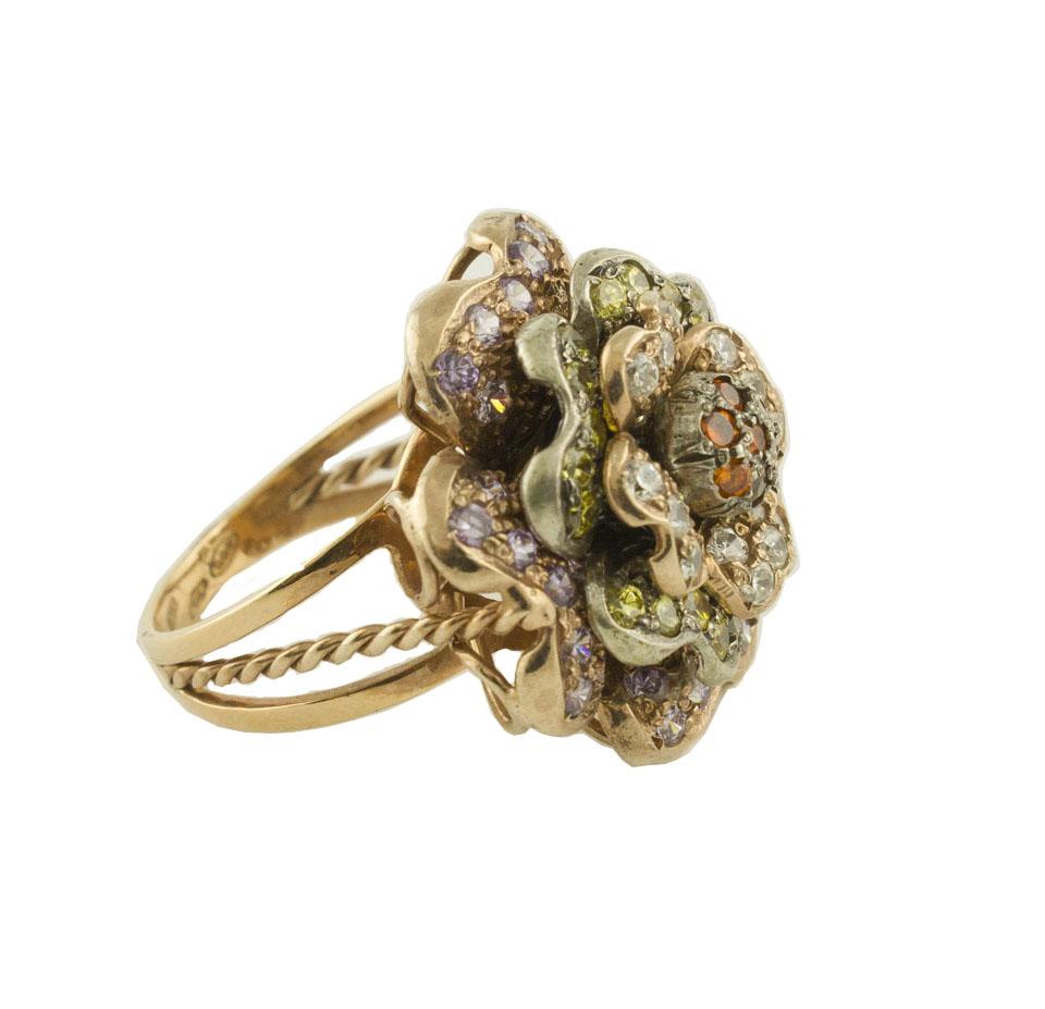 Fashion flower ring in 9K rose gold and silver studded by multi-colored hard stones
Hard Stones 1.13 g
Total Weight 11.30 g 
R.F + iia
Dimentions 2.4 cm X 2.4 cm 
Italian size 15
French size 55
Usa size 7.17