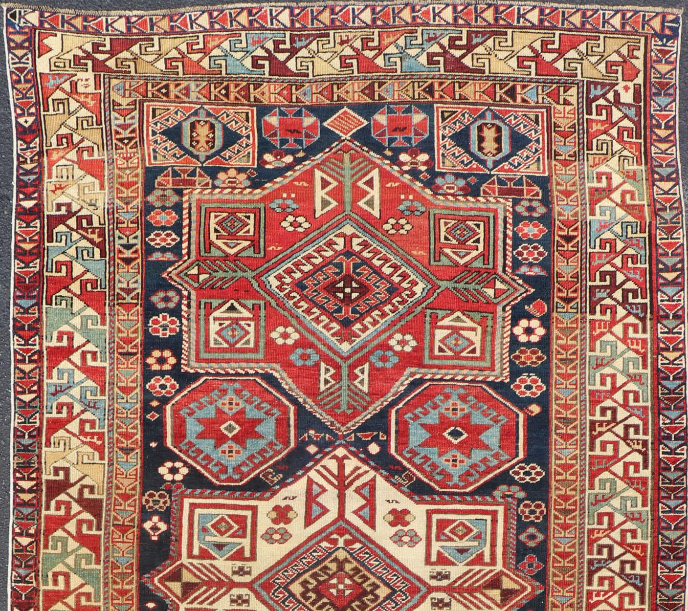 Geometric Design Kazak Caucasian Antique rug in jewel tones with layered medallions. Keivan Woven Arts / rug 18-1001, country of origin / type: Caucasus

Kazak rugs are among the most desirable Caucasian rugs. The vibrant reds, blues, and ivories