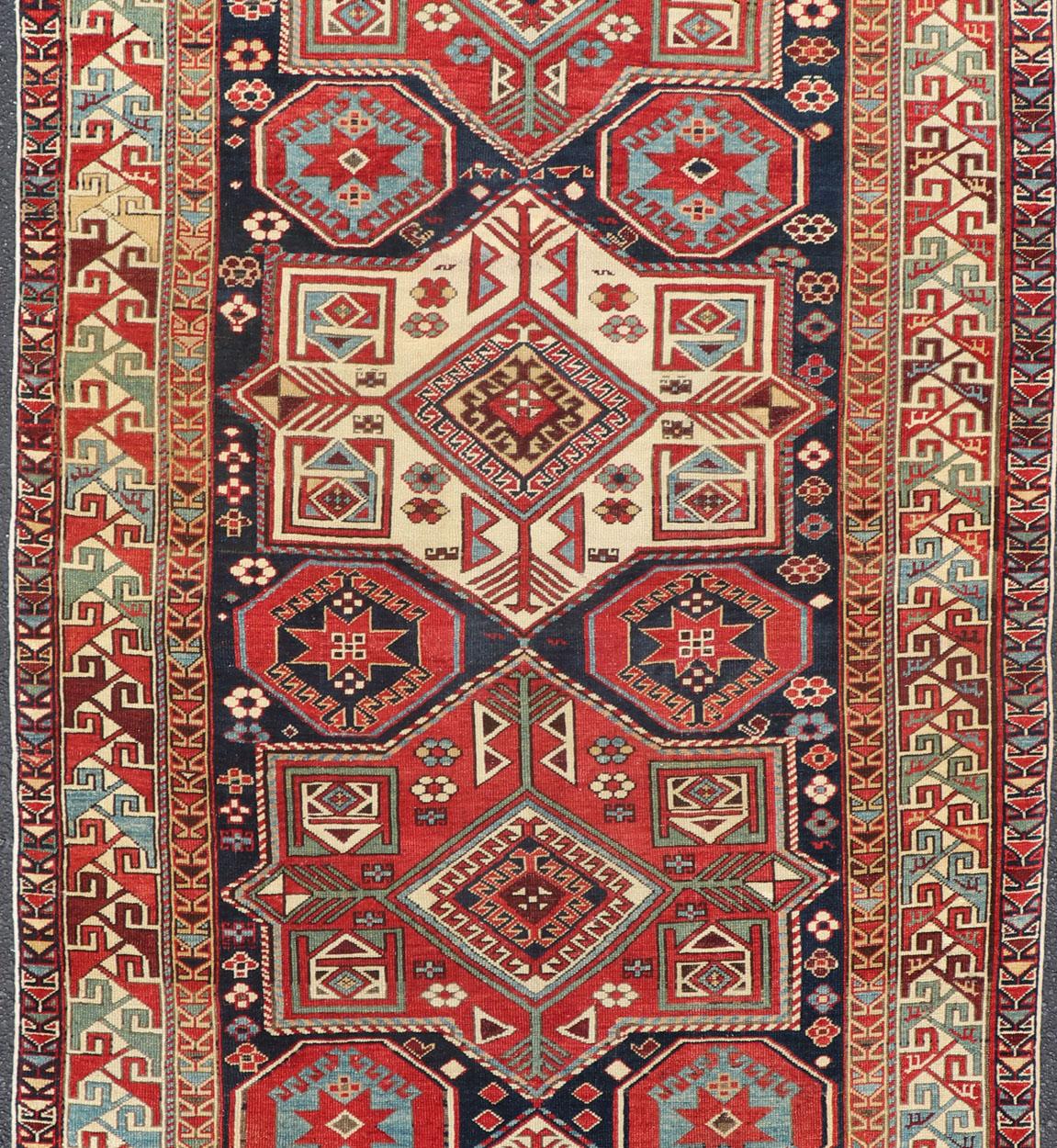 Hand-Knotted Multicolored Medallions Antique Caucasian Kazak Rug with Geometrics Motifs For Sale