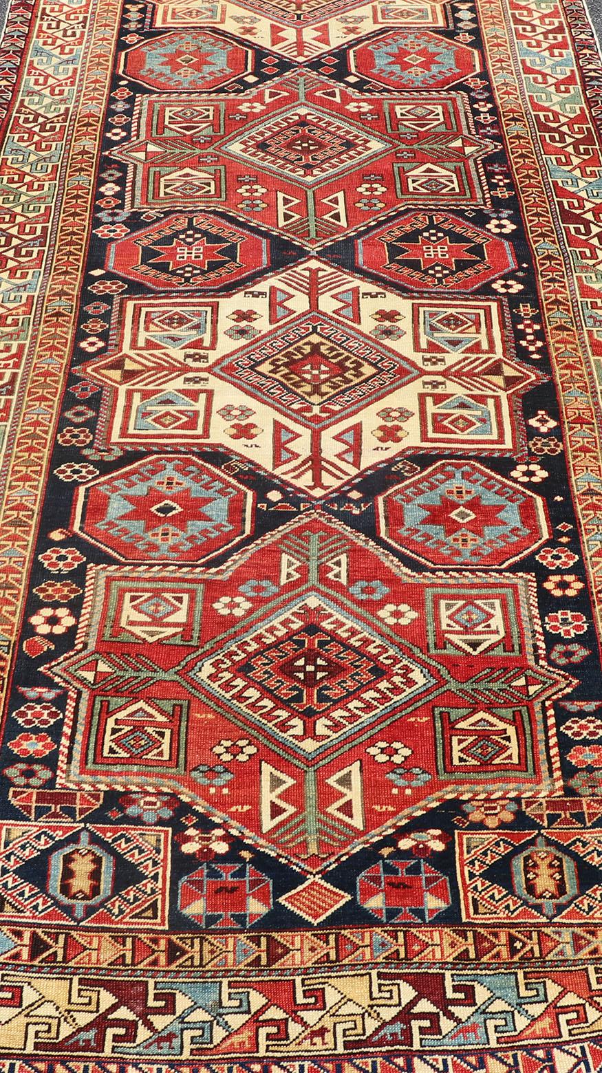 Multicolored Medallions Antique Caucasian Kazak Rug with Geometrics Motifs For Sale 1