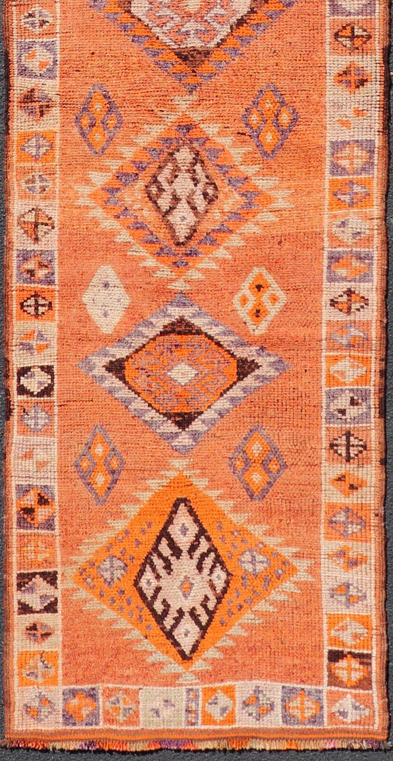 Measures: 3'0 x 14'2 
Multicolored Midcentury Turkish Kurdish Oushak Runner with Diamond Medallions. Keivan Woven Arts / rug TU-NED-5022, country of origin / type: Iran / Kurdish Oushak, circa 1950
This Kurdish tribal rug was woven with the emphasis