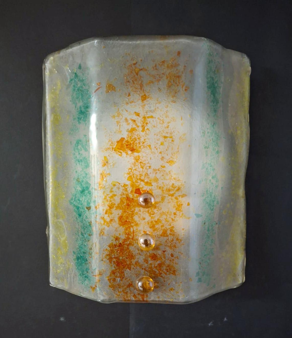 Vintage mid-century Italian wall light with a Murano glass shade in yellow red and green colors, mounted on white metal frame and secured with amber glass screws / Made in Italy in the style of Venini, circa 1960s
Measures: height 12 inches, width