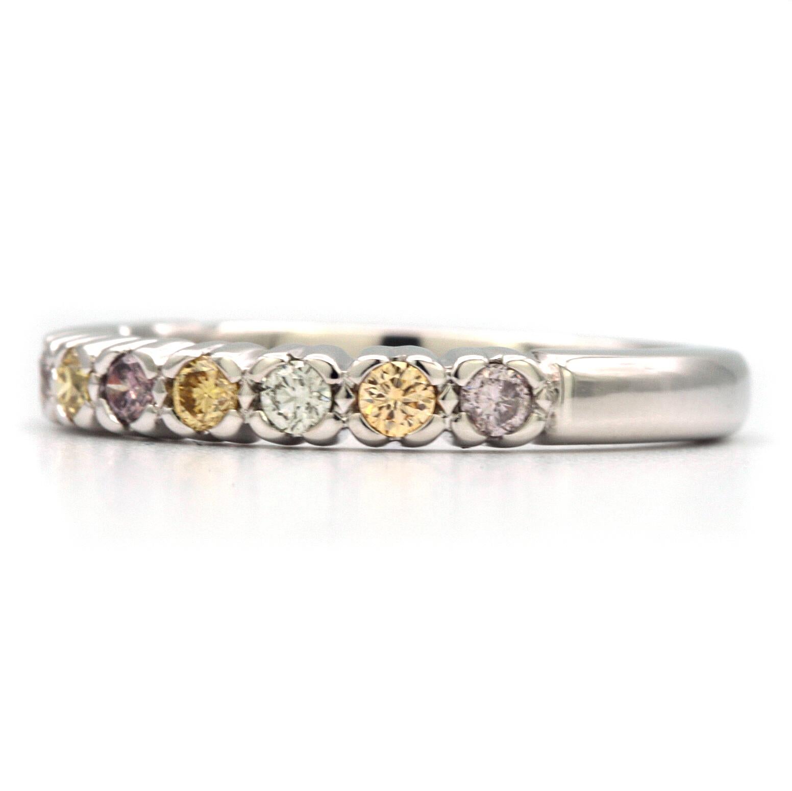 This elegant band contains 10 Natural Diamonds, 3 are very light purple, 4 fancy light yellow, 1 fancy intense purple, and 2 very light green. 
Can be worn alone or stacked with more rings!
All stones are approximately SI2/SI1 Clarity with good