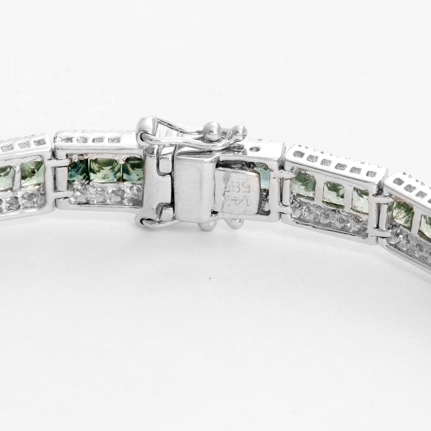 Multicolored Rainbow Sapphire & Diamond Bracelet - 14K White gold with gradient multicolored sapphires weighing 7.05 cts. with two rows of diamonds weighing 1.58 cts. Total weight 14.1 grams. Writs size up to a 7.5 inch wrist. This charming tennis
