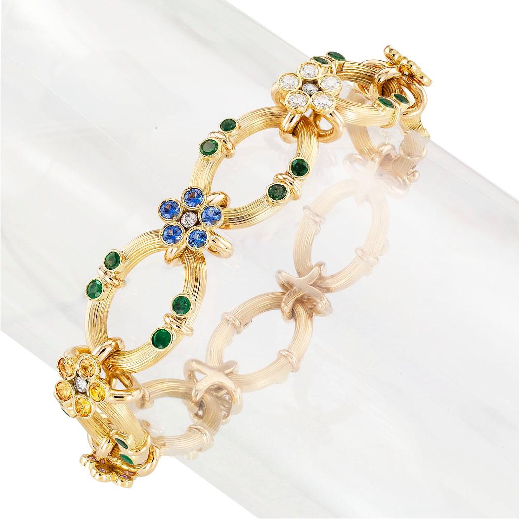 Estate  multi colored sapphire diamond emerald and yellow gold link bracelet circa 1990.  Love it because it caught your eye, and we are here to connect you with beautiful and affordable jewelry.  It is time to claim a special reward for Yourself! 