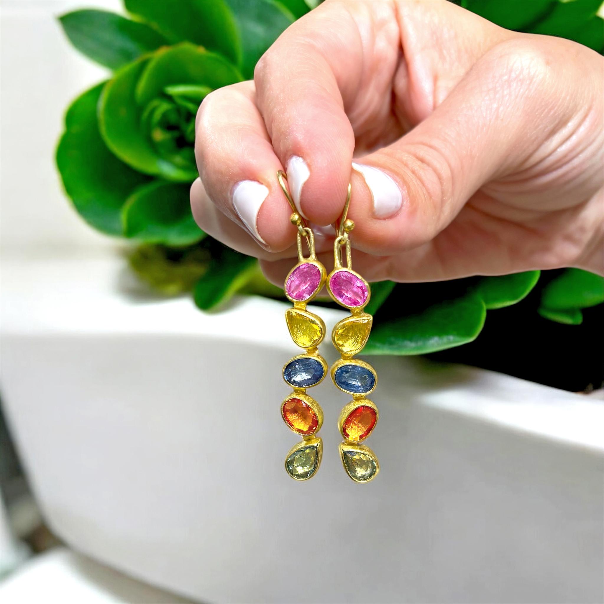 One of a Kind Linear Drop Earrings handmade in signature-finished 22k yellow gold by award-winning jewelry artist Petra Class showcasing a gorgeous, shimmering mix of faceted oval and teardrop shaped multicolor sapphires finished on 18k French ear