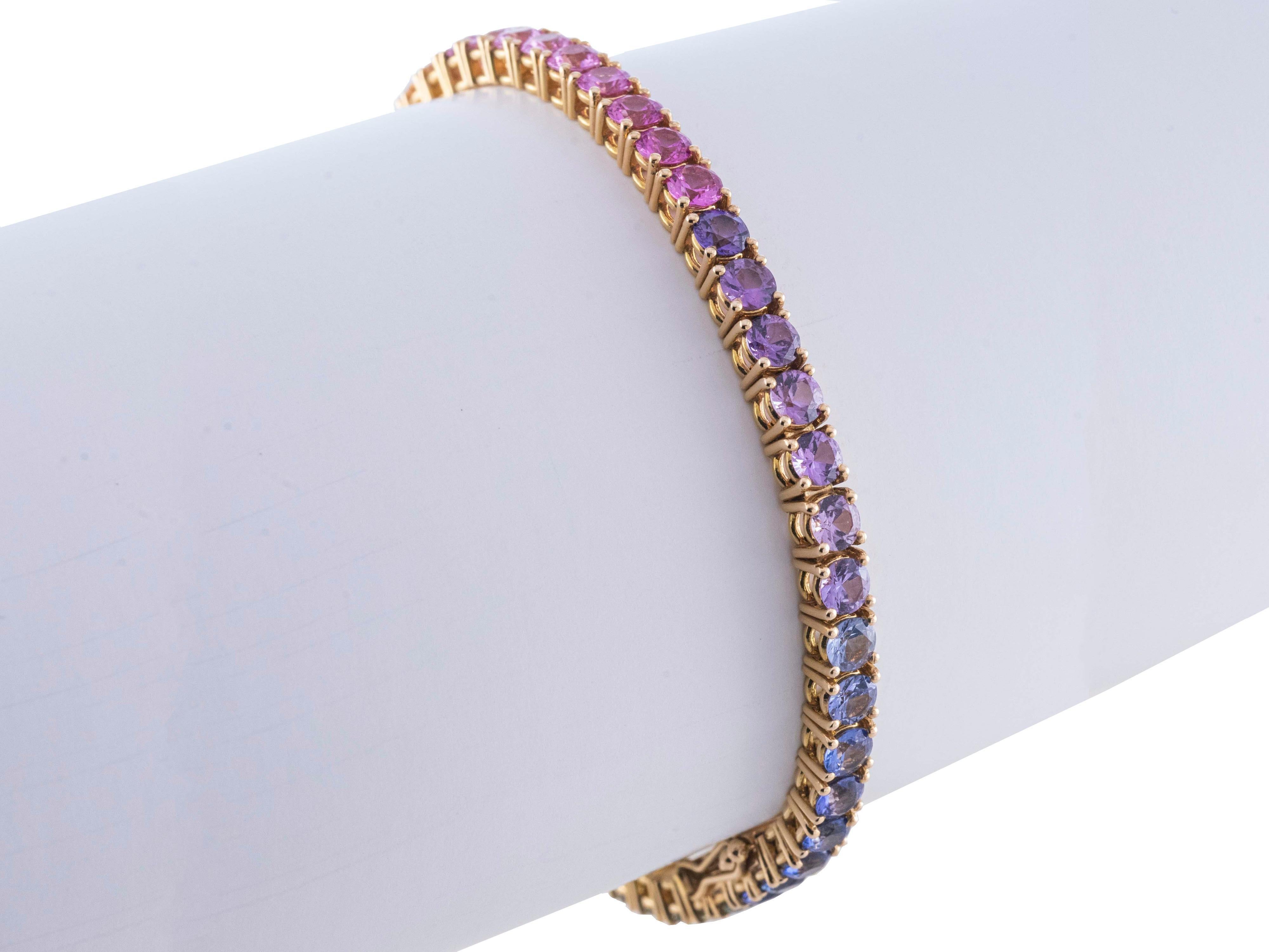 A tennis bracelet set with in 18 Karat rose gold and a very intense color quality multicolored sapphires.
Stones are round cut and the color vary from blue to green , orange to pink.
Total weigh of the stone is ct 10.30
The length of the bracelet is