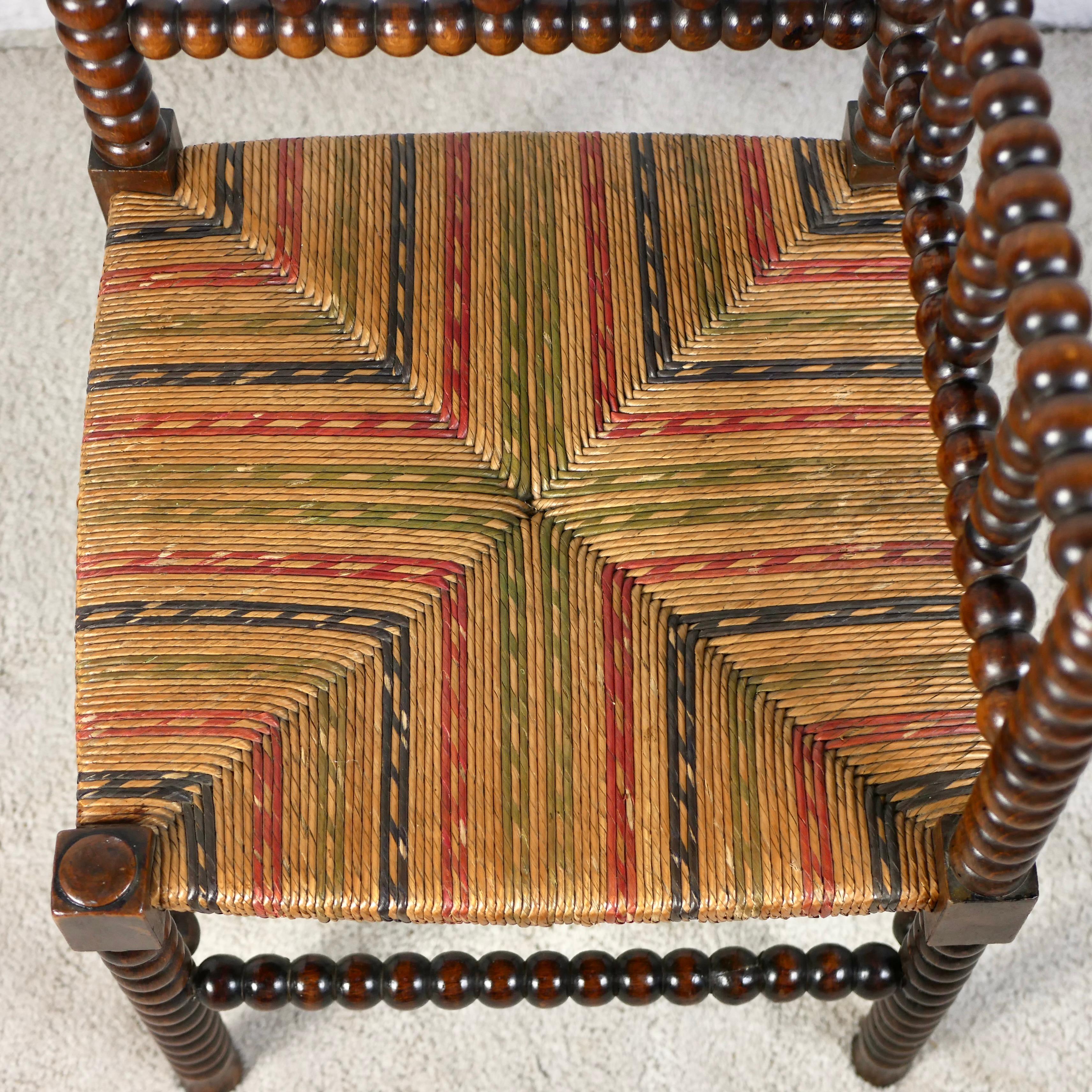 French Multicolored seat Bobbin corner chair, France, early 20th century For Sale