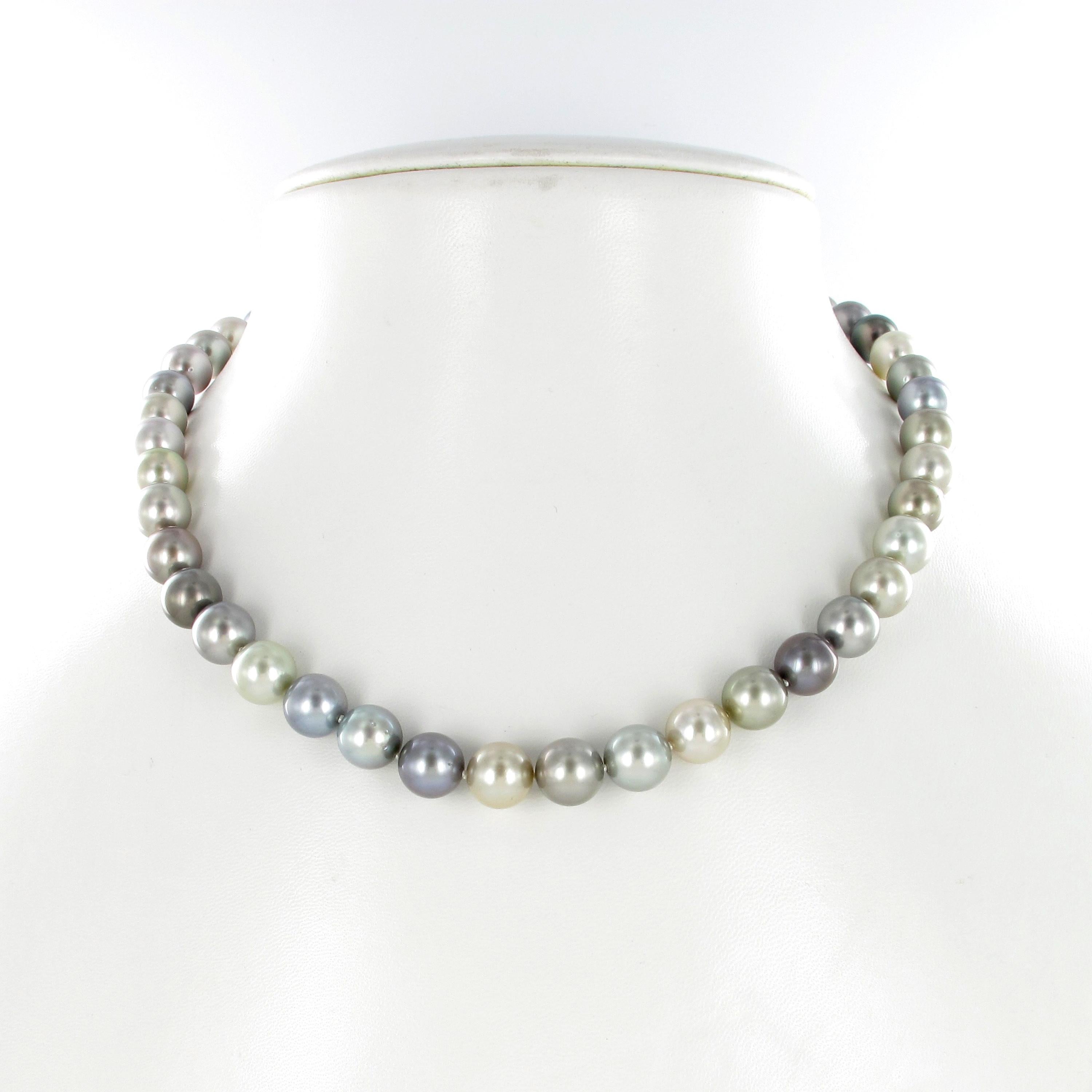 This strand consists of 44 round to slightly round multicolored Tahitian cultured pearls graduating from 9.0 mm to 10.0 mm. The different body colors range from very light gray to a mid light gray with purplish and bluish overtones. The overwhole