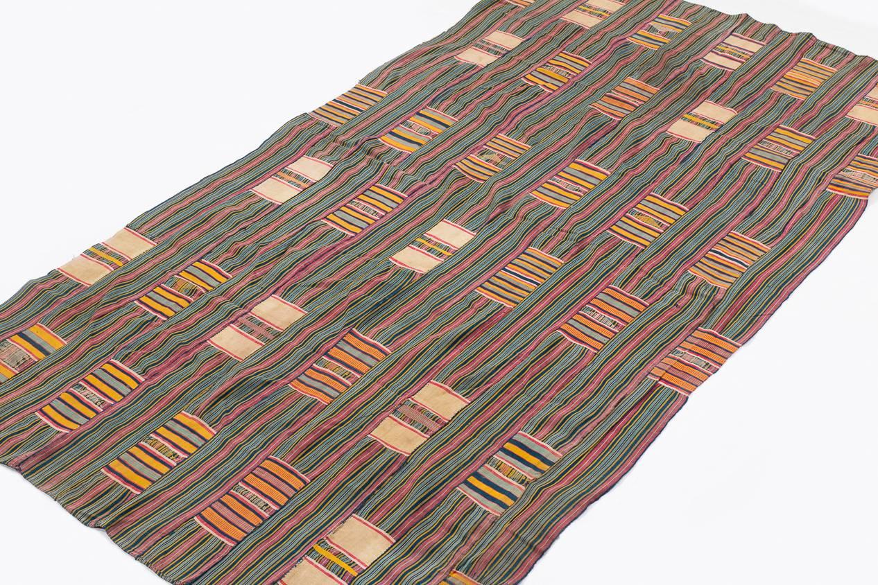 This Ewe wrap was woven by a true artist. The color placement resembles a patchwork quilt and the weaving is superb. These pieces were made for chiefs and the incredible skill and time that went into making them reflects their value as status