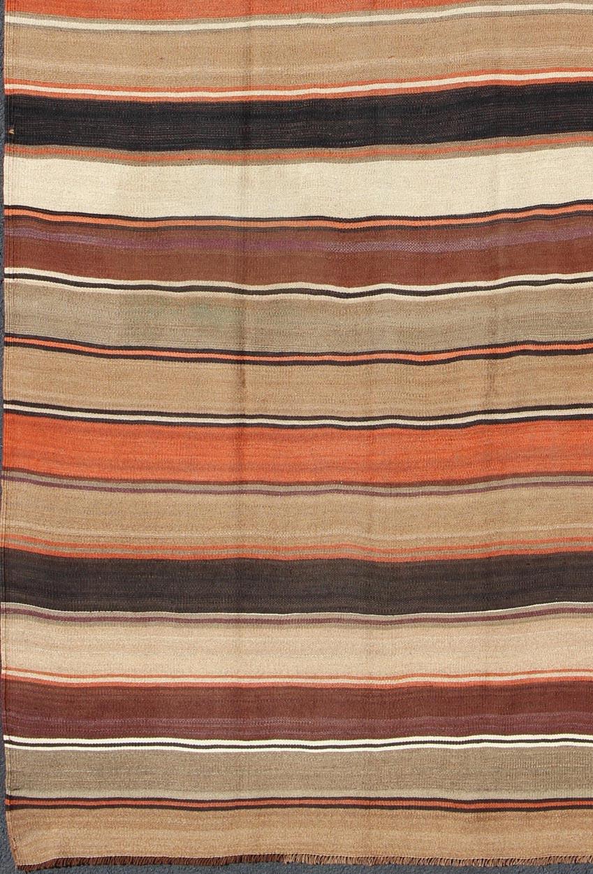 Large Multicolored vintage Turkish Kilim rug with horizontal stripes in orange, taupe, ivory, charcoal, and rust, purple, camel, Khaki ang green, rug/emd-11661, country of origin / type: Turkey / Kilim, circa mid-20th century

Featuring a repeating