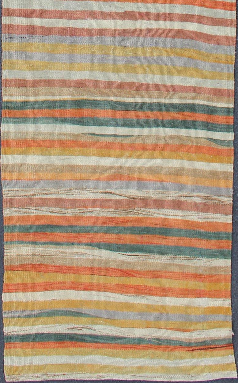 Multicolored vintage Turkish Kilim rug with horizontal stripes in orange, taupe, ivory, charcoal, and green. Keivan Woven Arts / rug/EN-176574, country of origin / type: Turkey / Kilim, circa mid-20th century

Featuring a repeating horizontal