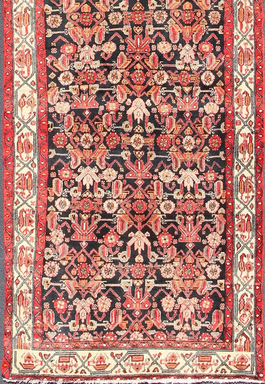 Sub-geometric Floral design Malayer runner vintage Persian in red and black, rug h-501-17, country of origin / type: Iran / Malayer, circa 1950.

This magnificent vintage Persian Malayer runner (circa 1950) bears a beautiful, expansive, all-over sub