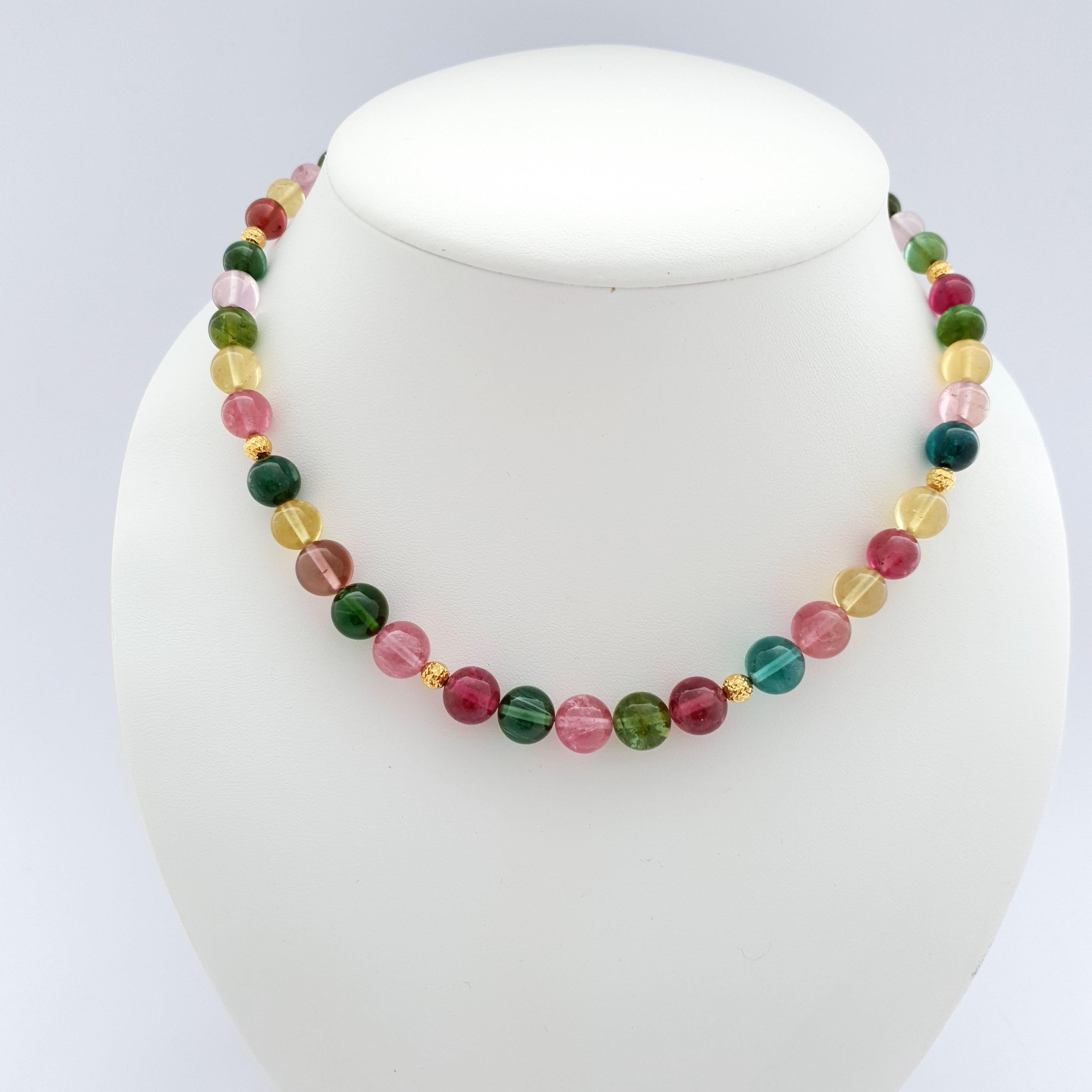 This Natural Multicolour Tourmaline Round Beaded Necklace with 18 Carat Yellow Gold is handmade in German quality.
The screw clasp is easy to handle and very secure. The colorful tourmalines go very well with different outfits.
Timeless and classic