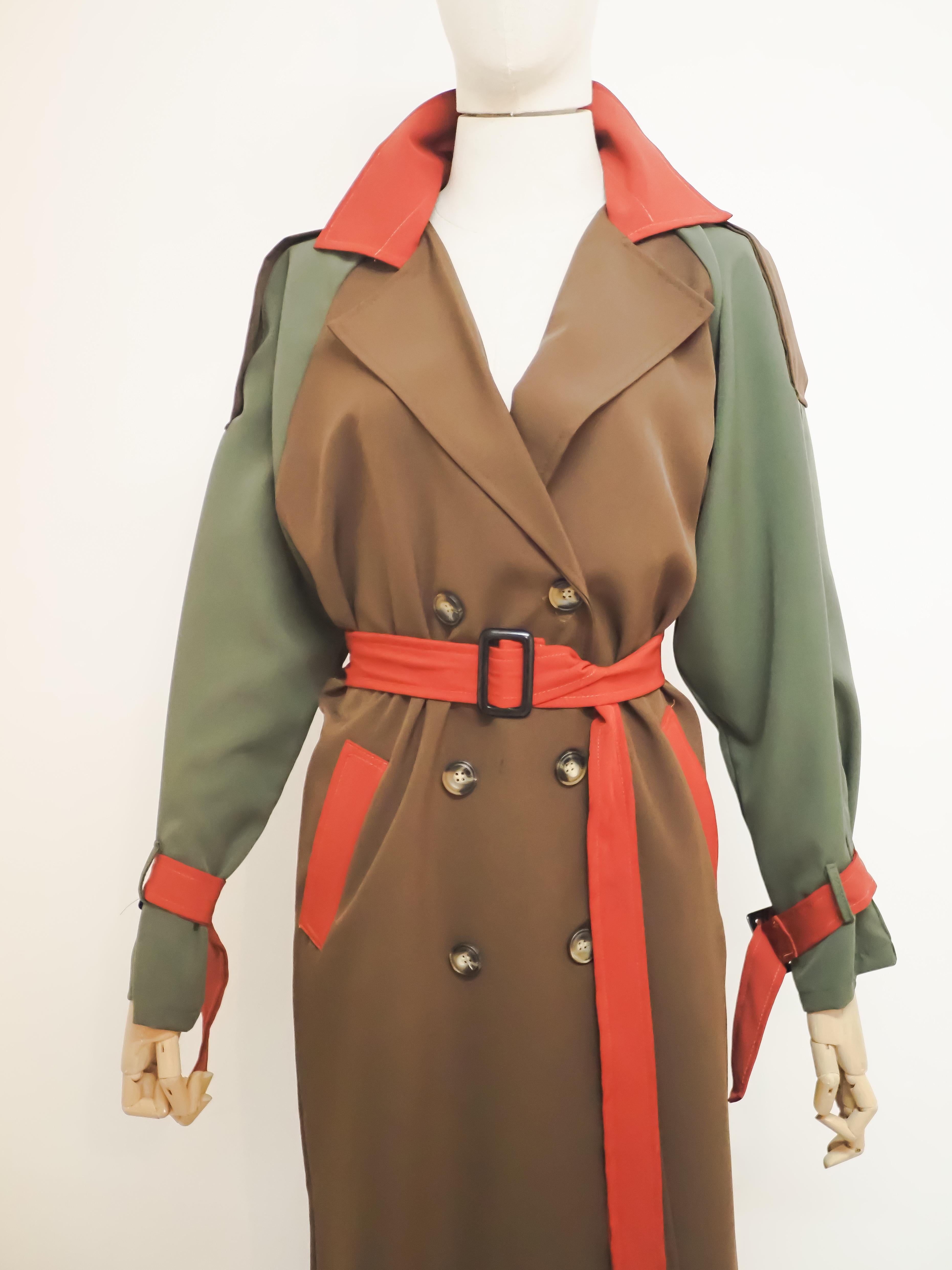 Multicoloured vintage trench-coat

Green, brown adn red multicoloured trench never been used in one size
belt is sizeable