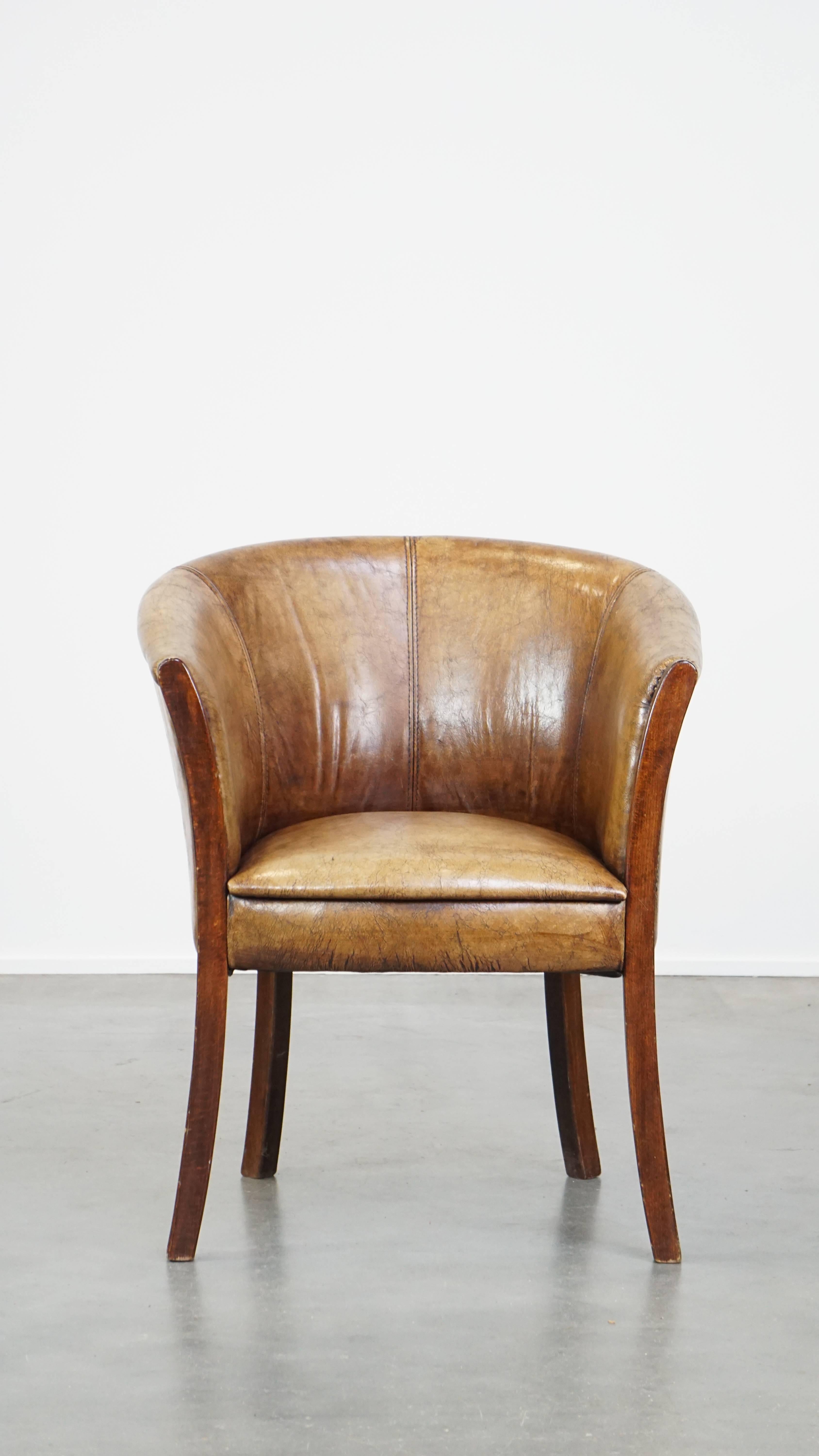 This cowhide side chair/armchair is multifunctional due to its compact size and higher seat height. As a result, this cowhide tub chair can be used both as a side chair and as a dining chair. With its clean finish and beautiful slender legs, this