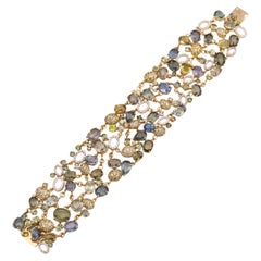 Durchbrochenes Armband mit mehreren Saphiren, Turmalinen und Diamanten aus 18 Karat Gelbgold