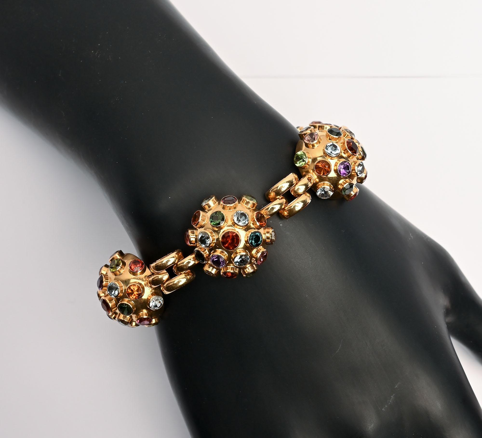 Rarely does one find a Sputnik bracelet. Rings and brooches are much more often seen. This  fine example has six domes encrusted with faceted stones that include citrine; green tourmaline and blue topaz. Each dome measures 5/8 inch in diameter. They