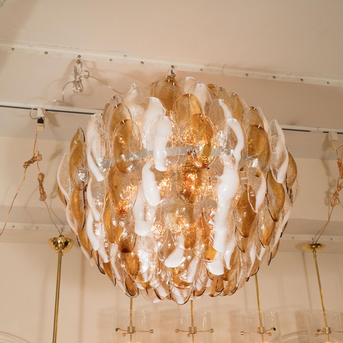 Multilayered chandelier composed of oval amber, frosted and clear glass elements by Mazzega.