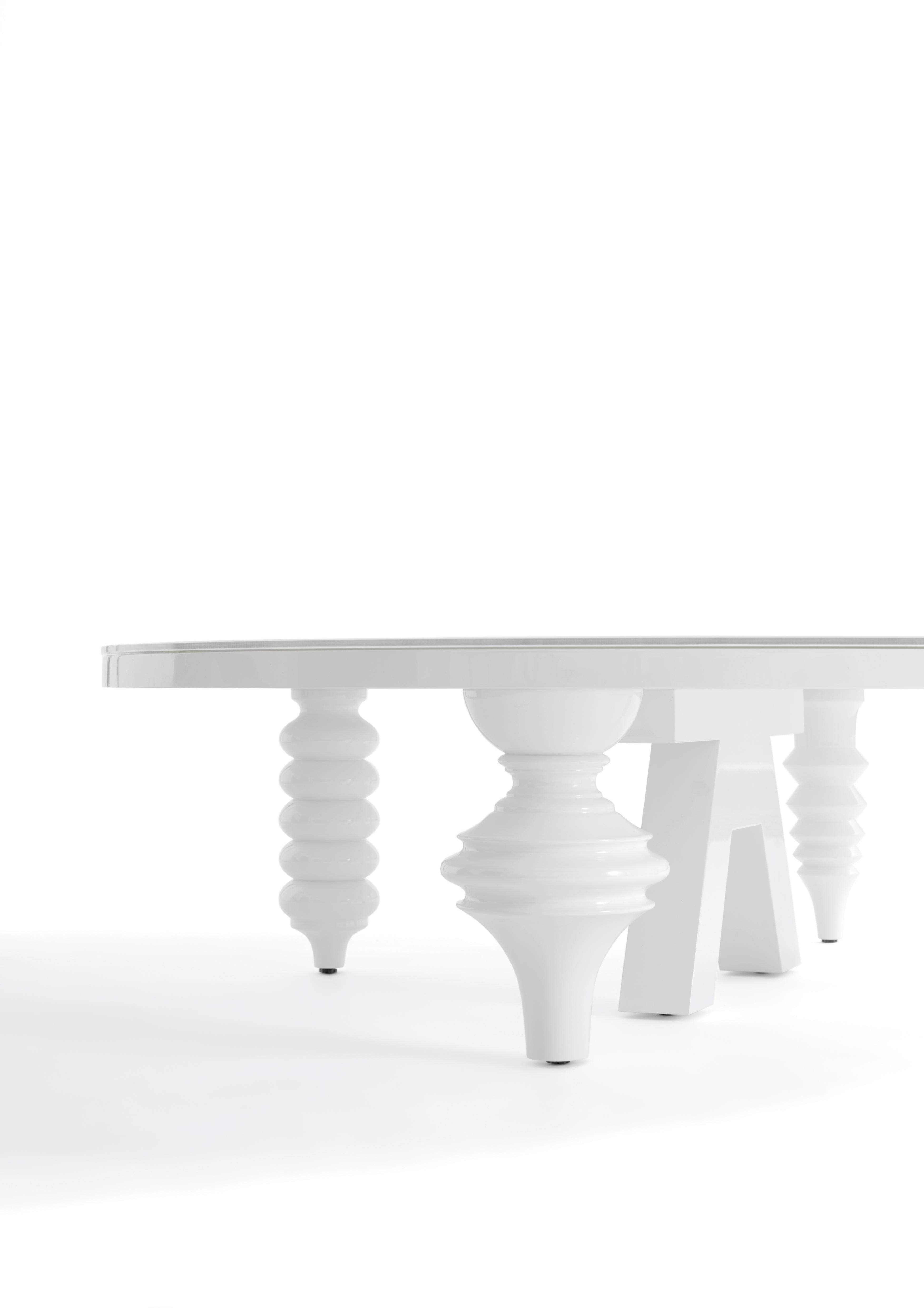 The Multileg Table came about in an obvious way, springing from the Multileg Cabinet. Using the same legs, Jaime designed four table tops, converting them into functional sculptural centre pieces.

Base in MDF. Glass top of 8 mm lacquered on the