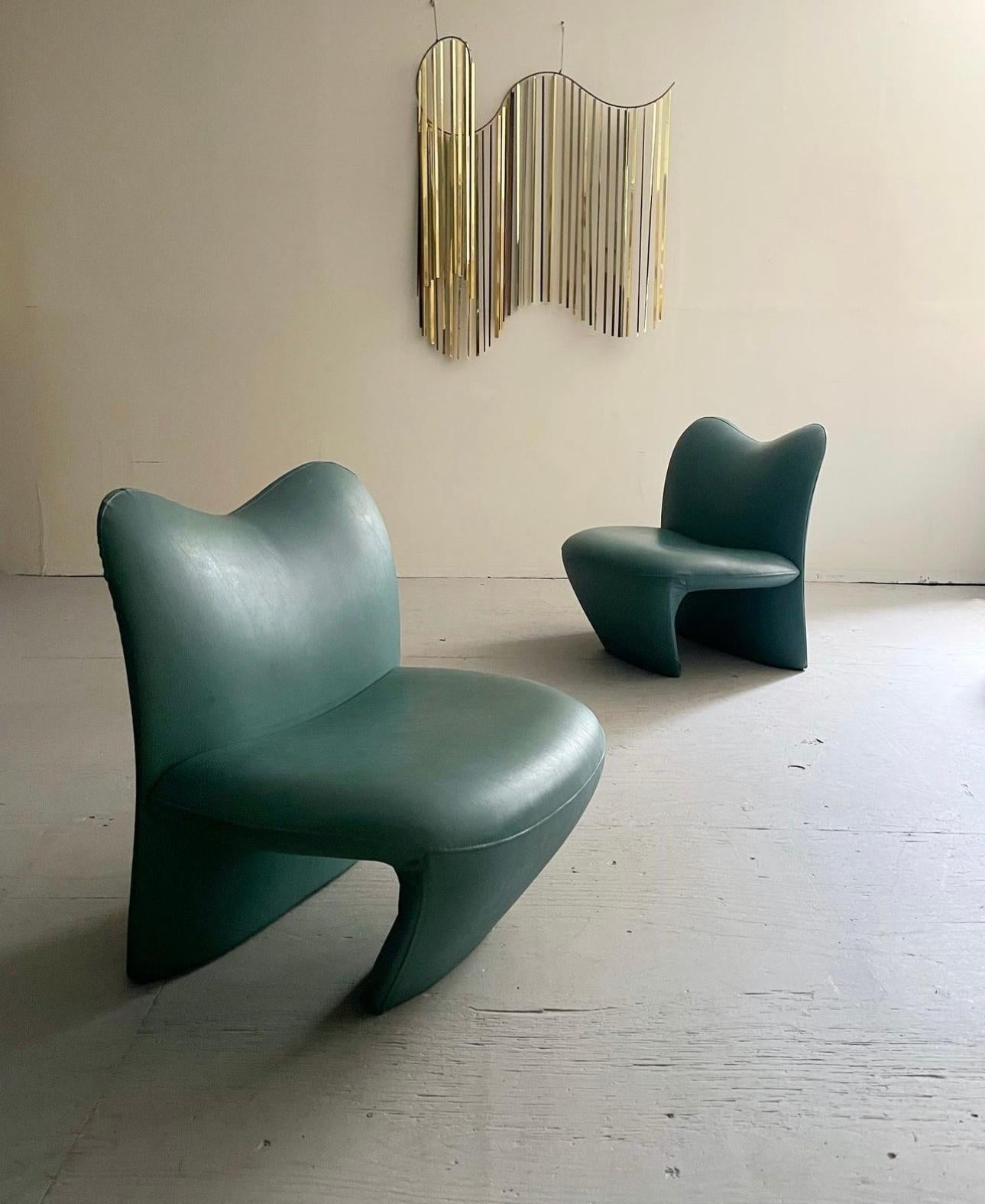 Pair of Post Modern “Multipla”Lounge Chairs Designed by Jane Dillon & Peter Wheeler. These sculptural lounge chairs feature a biomorphic silhouette upholstered in a leather teal fabric. Jane Dillon studied under Ettore Sottsass in the late 1960s and