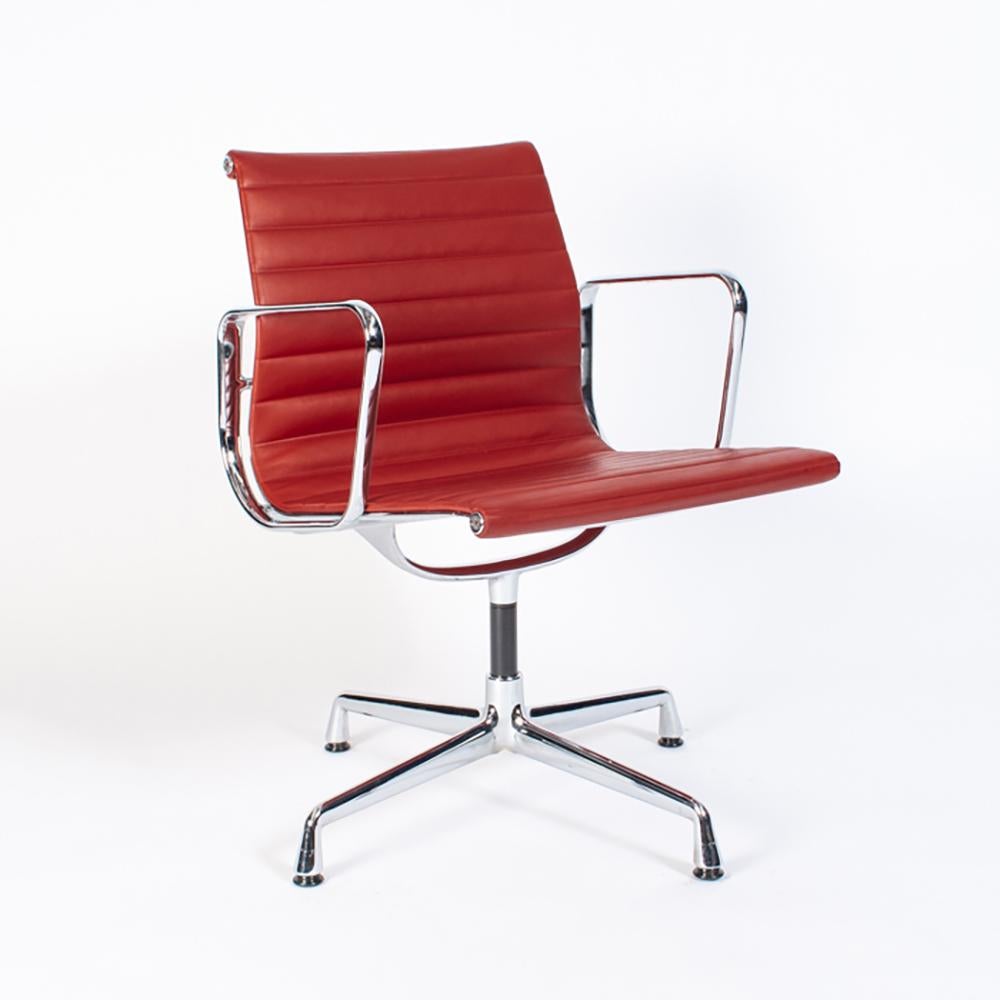 Comfortable dining and/or conference chairs in very good / excellent condition with minimal light wear. Lightweight chrome-plated aluminium frame with swivel mechanism and red leather upholstery. Signed with manufacturer''s sticker and labels.