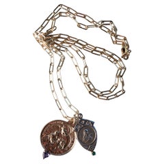 Chaîne collier de la Vierge Marie avec cœur en émeraude, tanzanite et argent