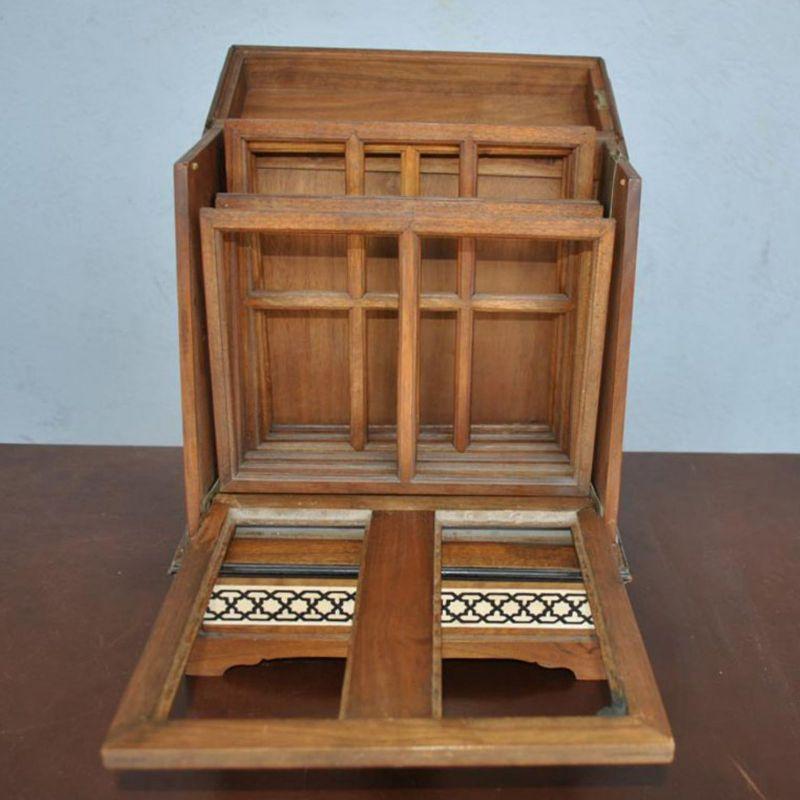 Multiple wooden photo frames and inlays from the early 20th century, oriental style, 40 cm high, 30 cm wide and 23 cm deep.