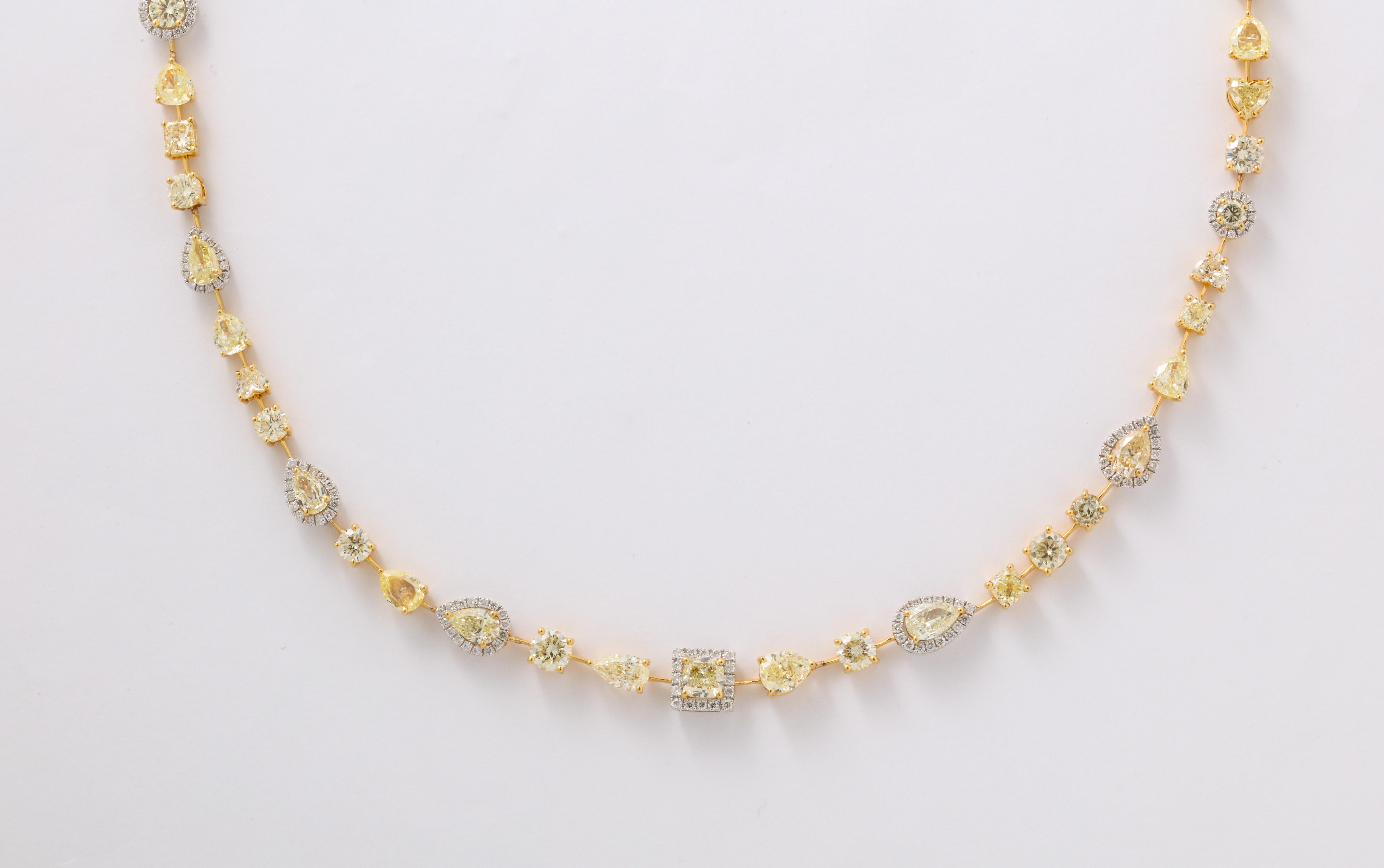 
A beautiful WEARABLE design. 

23.16 carats of yellow and white diamonds set in 18k white and yellow gold.

This necklace features heart, princess, round, pear, cushion and oval shapes. 

18.5 inch length -- Available in different lengths as well.