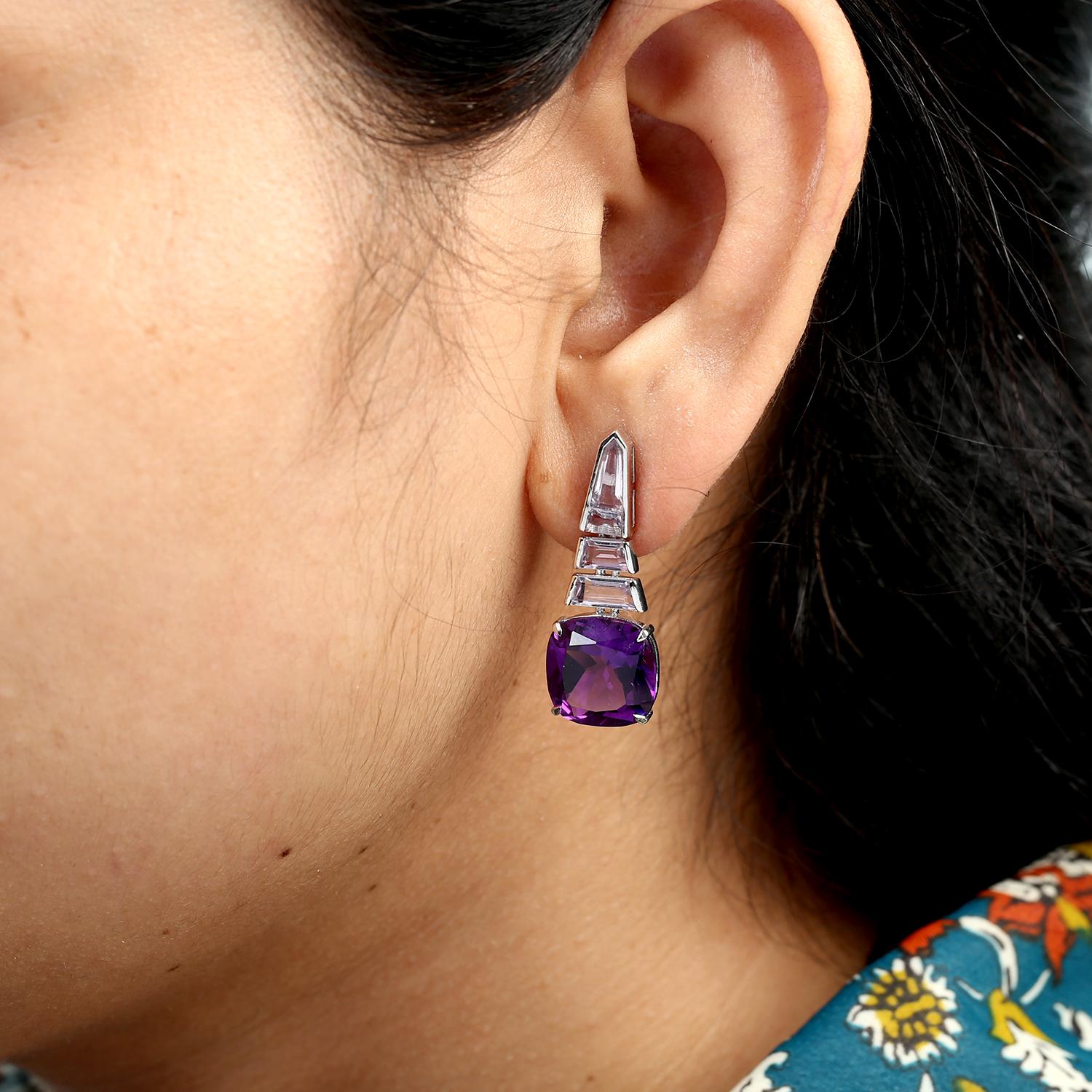 A striking pair of dangle earrings featuring multi-shaped amethysts in rich purple tones. Set in 14k white gold, these earrings combine bold color with elegant design, perfect for adding a vibrant touch to any look.

Metal Details
14k White