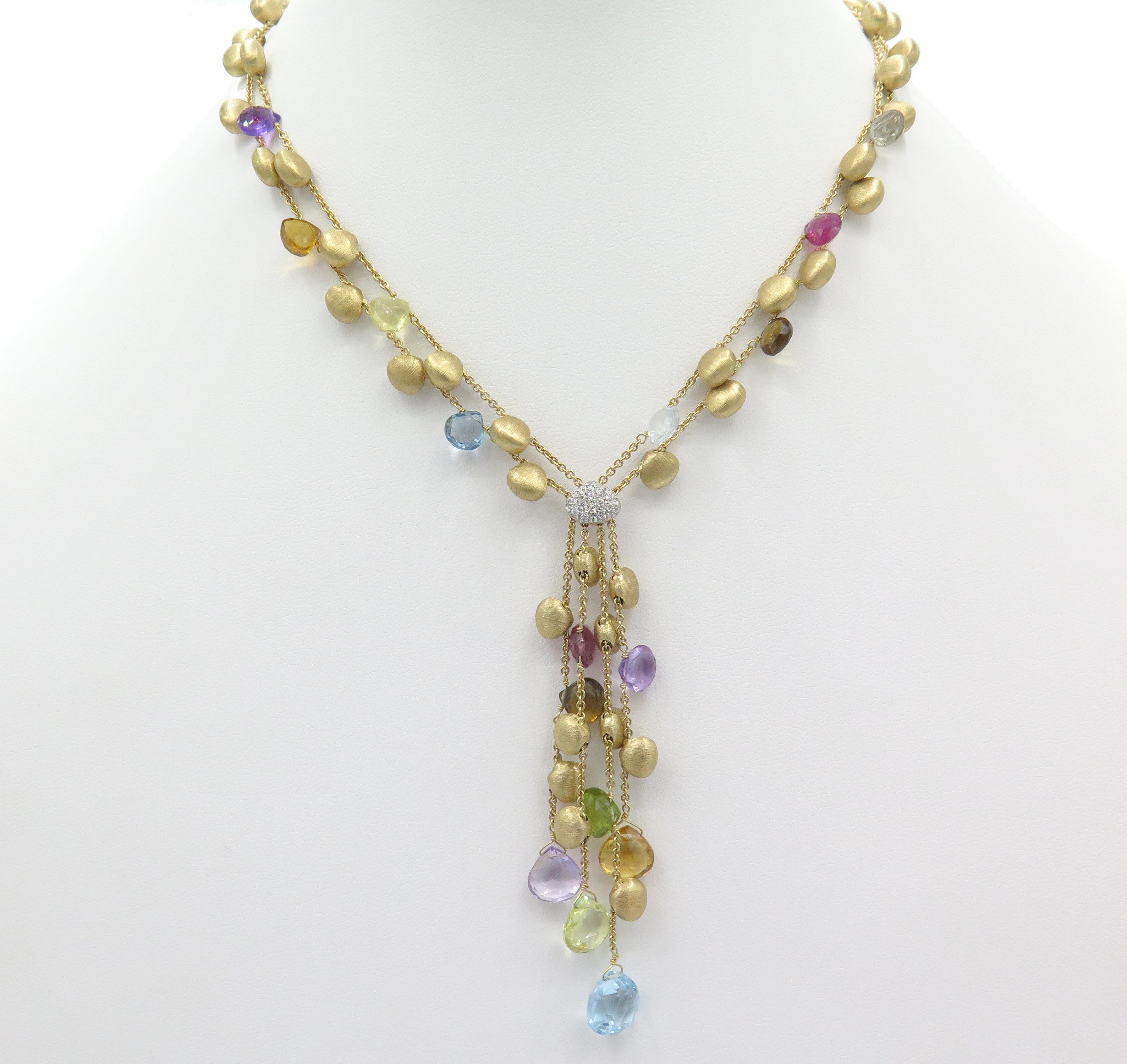 A, beautiful 18kt Marco Bicego, multi strand, two-tone gold diamond necklace feature an array of, extravagant briolette cut multi colored stones.In, a beautiful satin brushed yellow and white gold finish. The, necklace is 18kt. The length of the