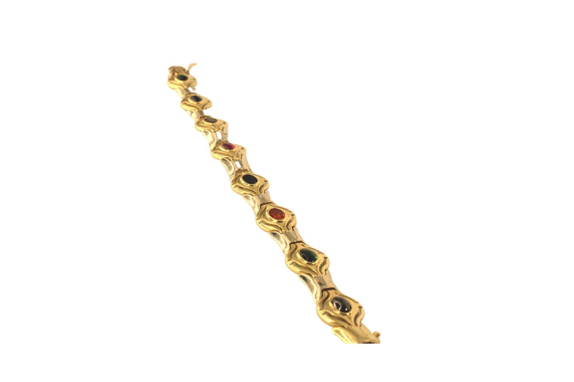 Multy Color Stones 14 karat Yellow-White Gold Bracelet
14 Karat Multi-Gemstone bracelet. This colorful link bracelet contains eleven oval faceted gemstones yellow gold
 length- approximately 7.3 inches or (18.7 cm)
width-approximately 1.5