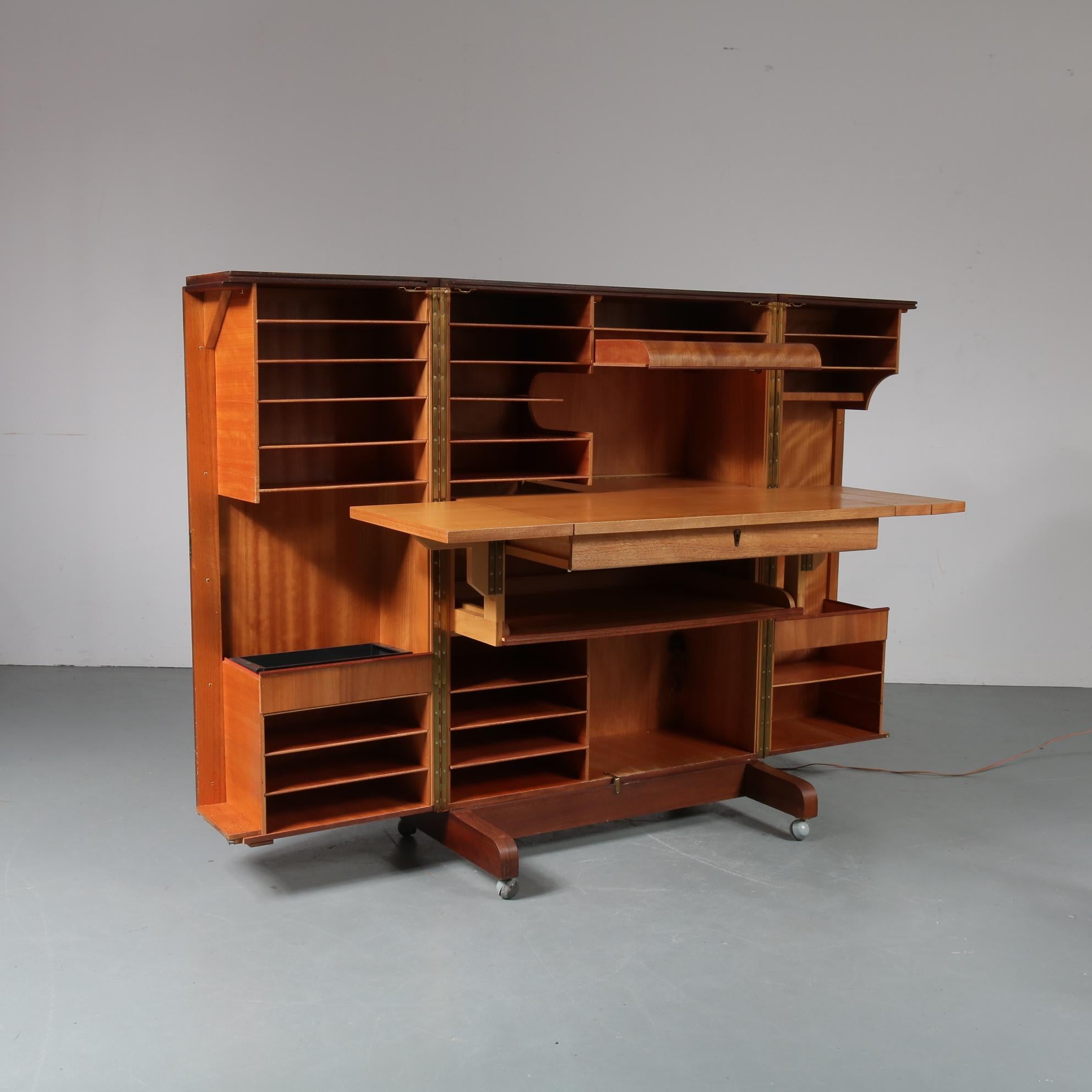 An impressive foldable desk or working station designed by Mummenthaler and Meier, manufactured in Switzerland, circa 1950.

This amazing cabinet is nicknamed 